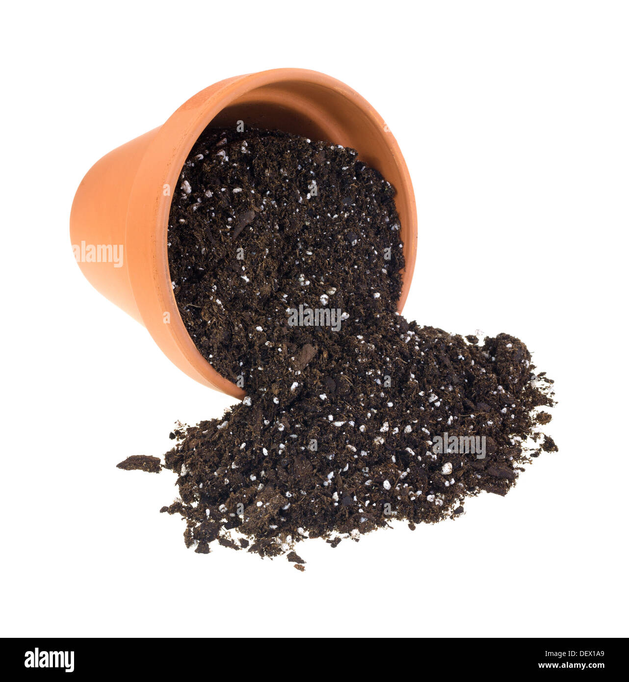 Organic potting soil spilling from a red clay plant pot onto a white background. Stock Photo