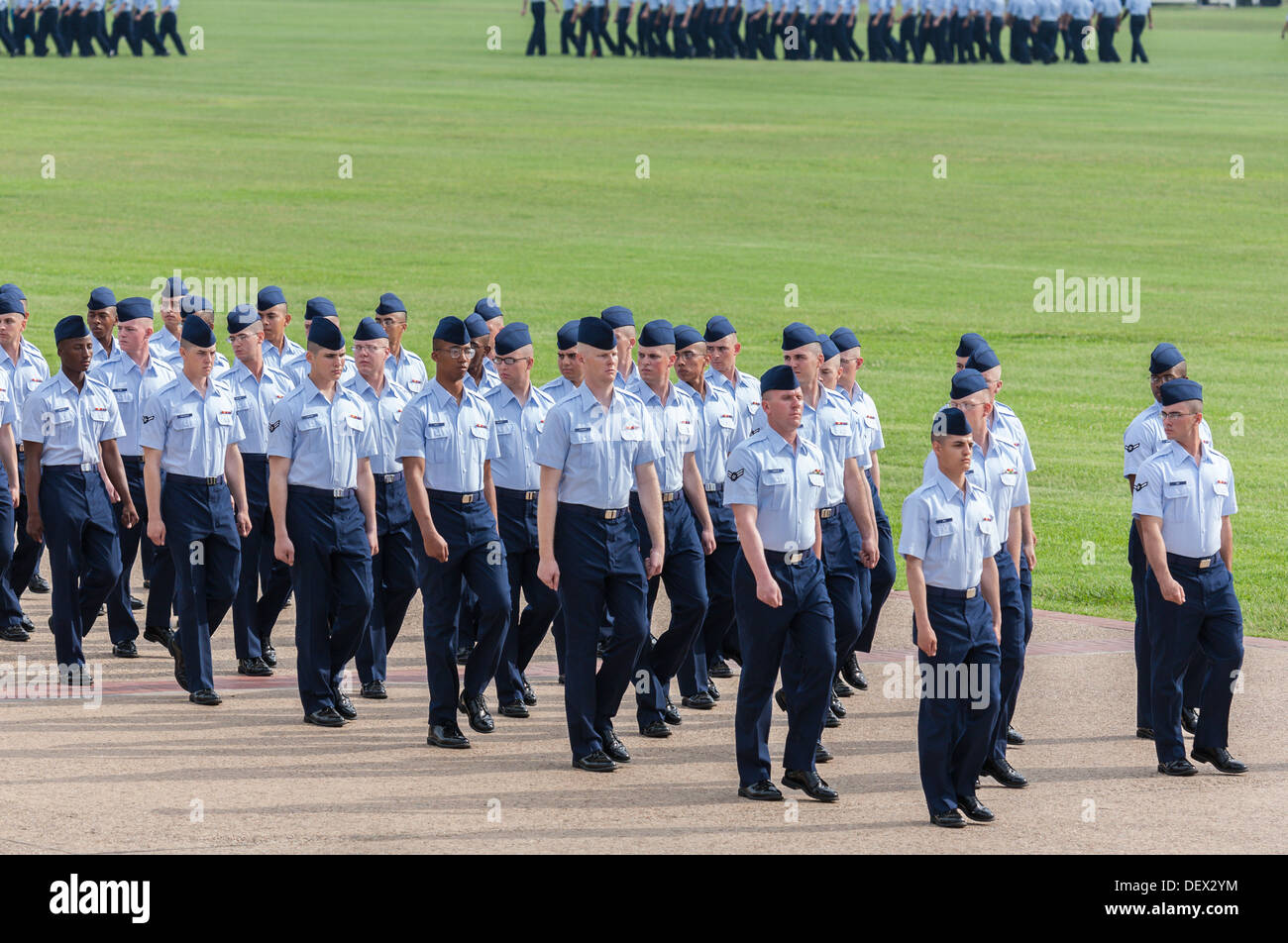 Flight of airmen in dress blues marching during United States Air Force basic training graduation In San Antonio, Texas Stock Photo