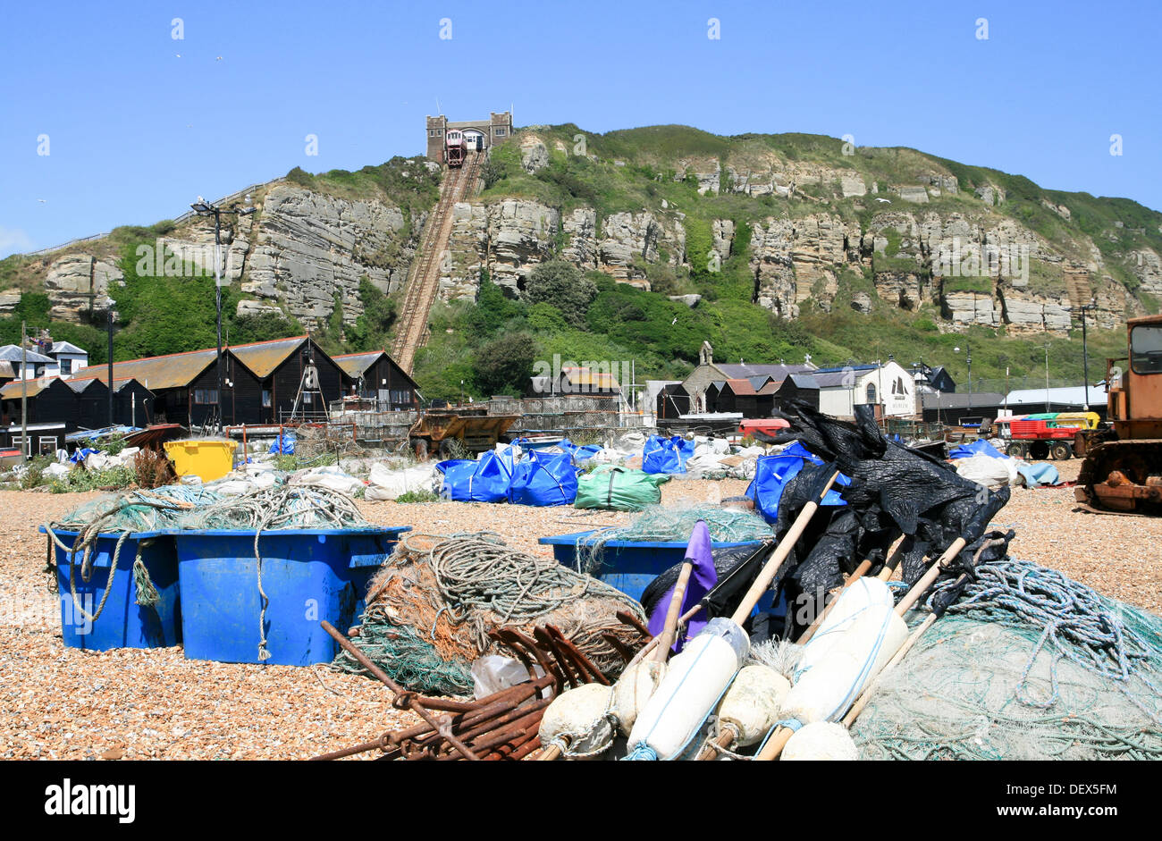 fishing gear beach and cliffs Hastings East Sussex England UK Stock