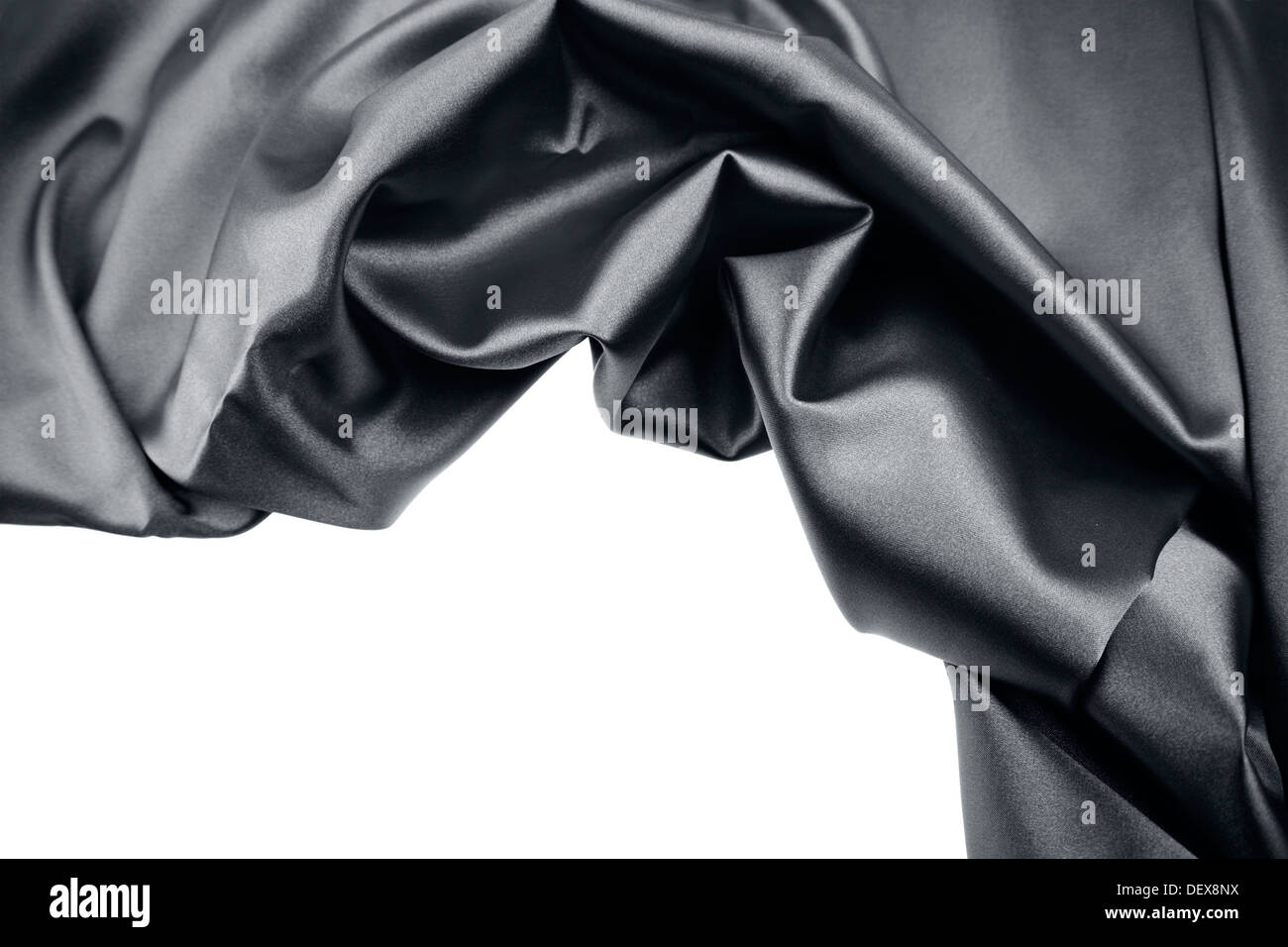 Closeup of rippled black silk fabric on plain background Stock Photo