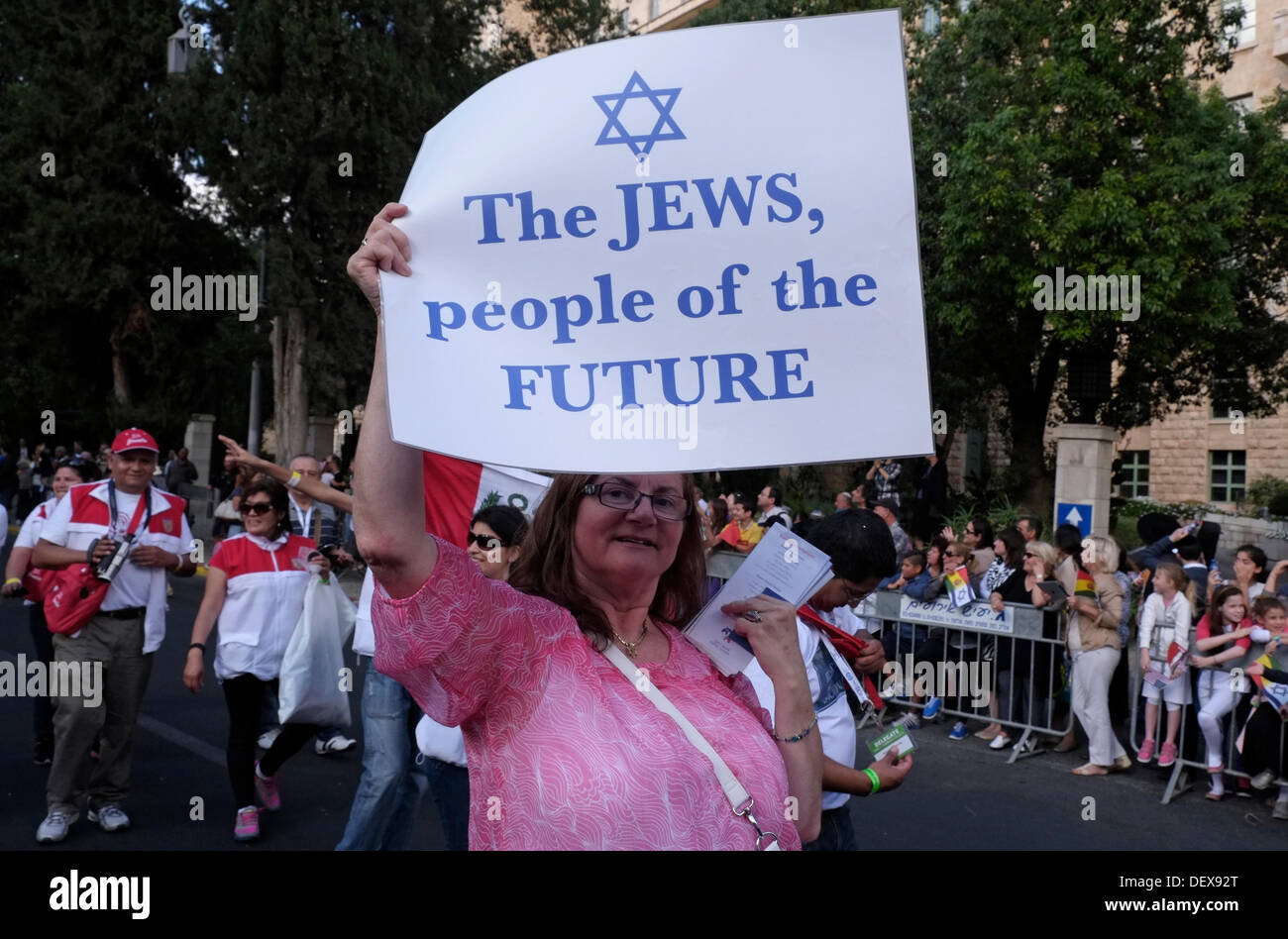 An Evangelical Christian holds a paperboard sign which reads 'The Jews People of the Future' during the annual Jerusalem March during Sukkot feast of the Tabernacles to show their love for the Jewish people and the state of Israel. The parade is hosted by the International Christian Embassy Jerusalem (ICEJ) and draws thousands of Christians from around the world in support of Israel. Stock Photo