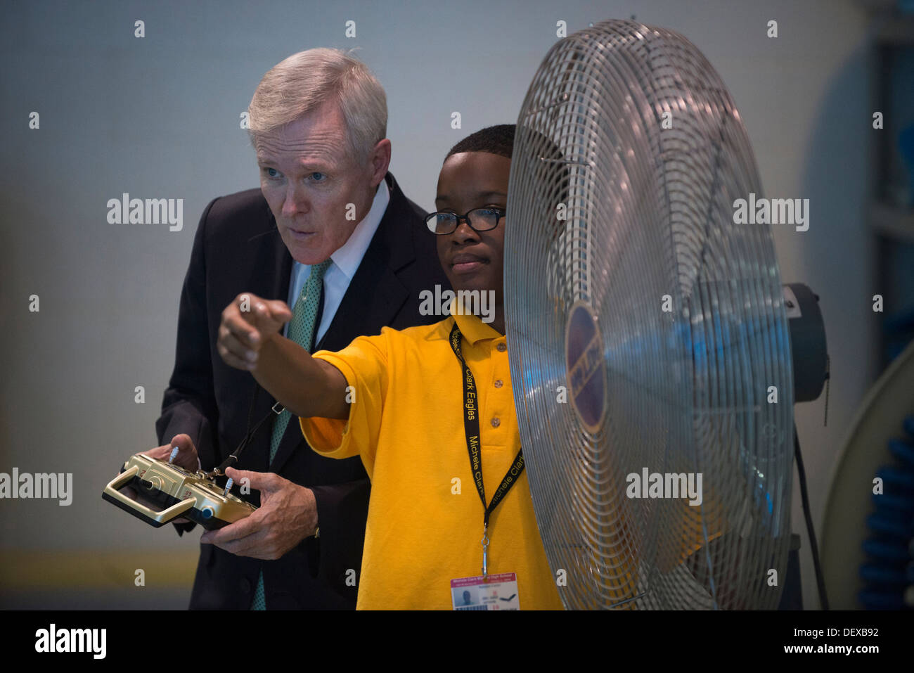 Secretary of the Navy Ray Mabus operates a remote-controled boat during a Science, Technology, Engineering and Mathematics (STEM) event at Michele Clark High School. During the visit to the school, Mabus and Emanuel also took part in a round table discuss Stock Photo