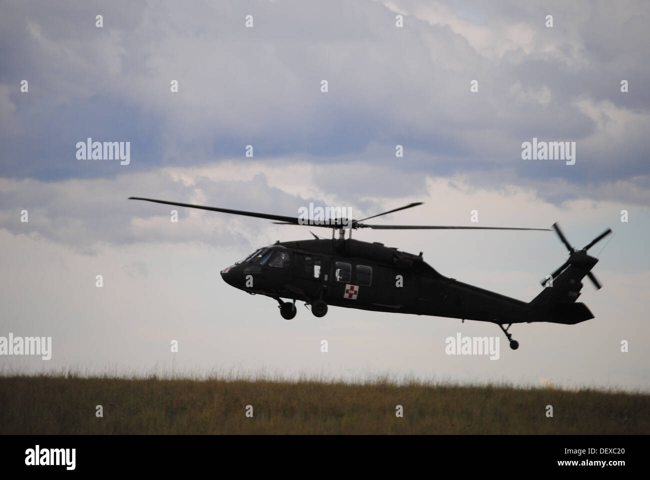 A Wyoming Army National Guard UH-60 Black Hawk takes off to support flood evacuation efforts in Colorado Sept. 14, 2013. Guardsmen were activated through the Emergency Management Assistance Compact--a national mutual aid parternship agreement allowing sta Stock Photo