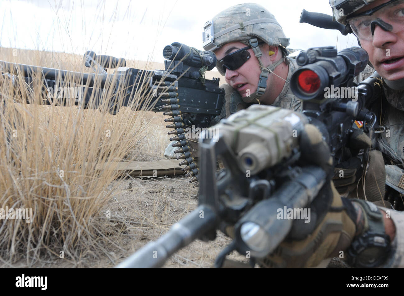 U.S. Army Sgt. Kenton Miller, right, and Spc. James Irvine with 5th Battalion, 20th Infantry Regiment, 3rd Stryker Brigade Combat Team, 2nd Infantry Division, look down their sights for possible enemy activity during a joint platoon exercise at the Yakima Stock Photo