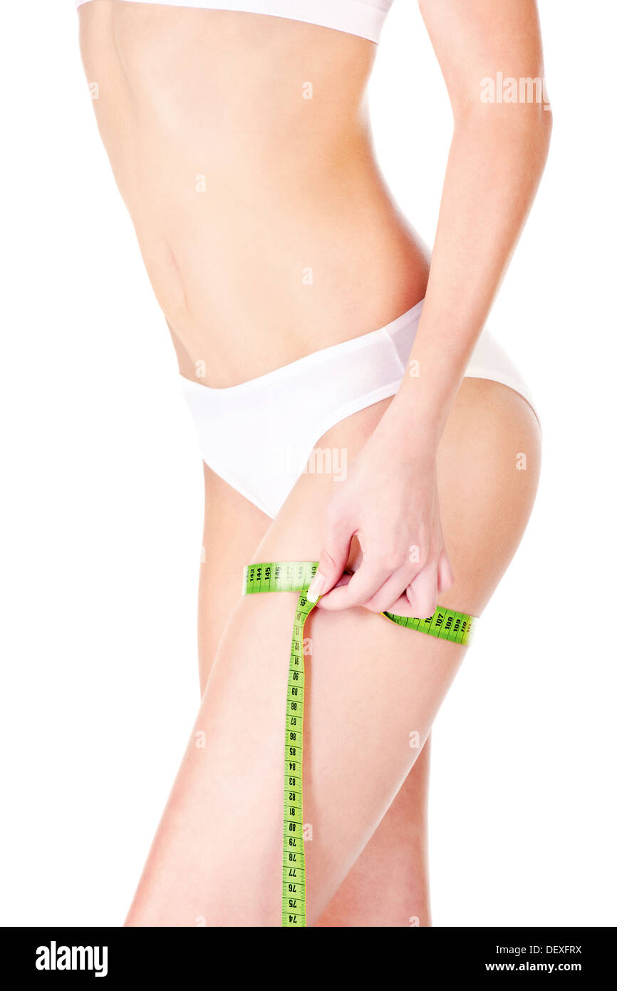 Measure tape around slim woman's leg, isolated on white. Health concept Stock Photo