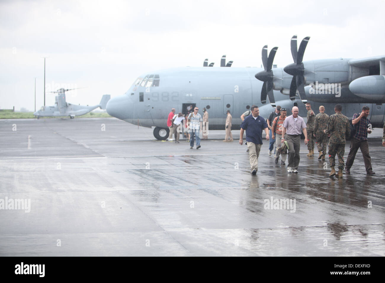 Marines with the advanced party for Amphibious Landing Exercise 2014 disembark a KC-130 Hercules Sept. 14 at Clark Air Field, Pampanga, Republic of the Philippines. The Marines, with the 13th Marine Expeditionary Unit, 3d Marine Expeditionary Brigade and Stock Photo