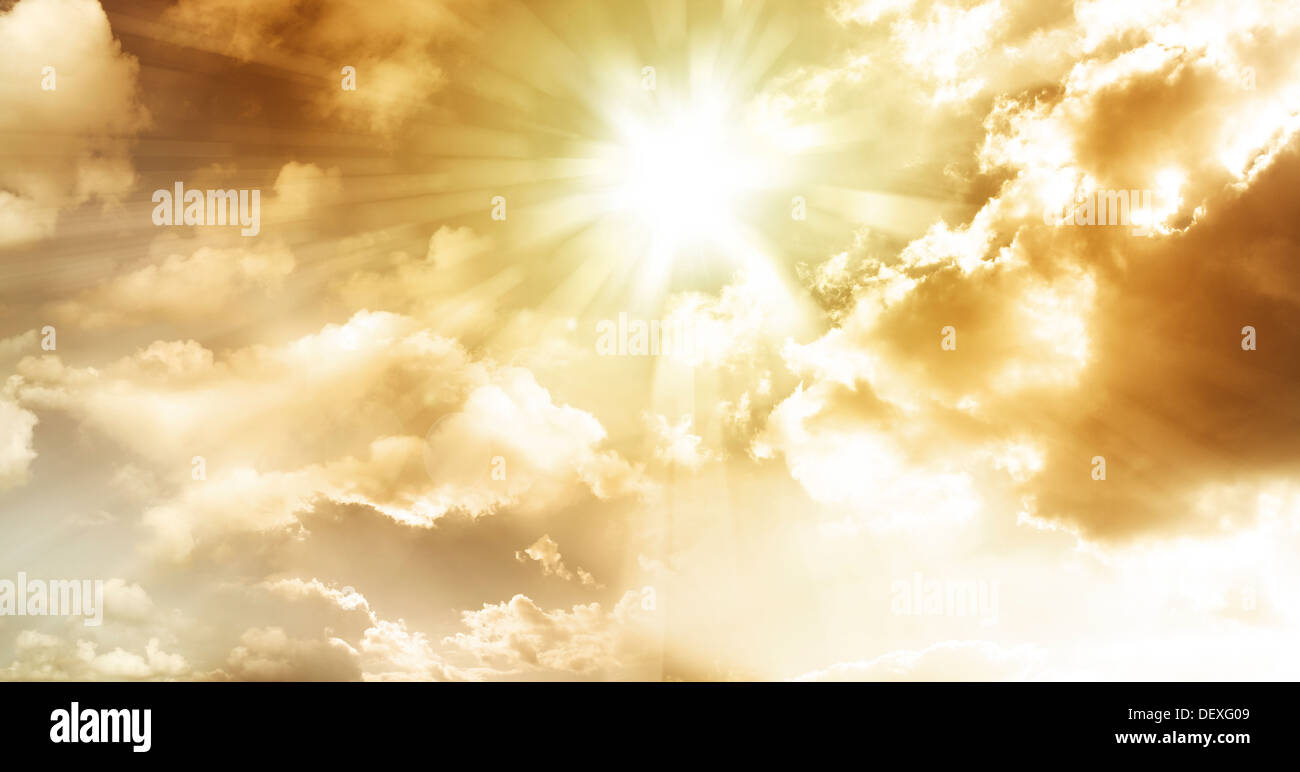 Sun rays in cloudy sky Stock Photo