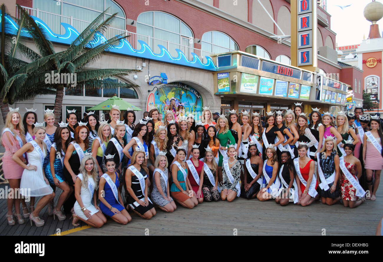 Miss America 2014 contestants pose for a photo opportunity in front of Jimmy Buffett's Margaritaville Café on the historic Boardwalk in Atlantic City, N.J., Sept. 13, 2013. Stock Photo