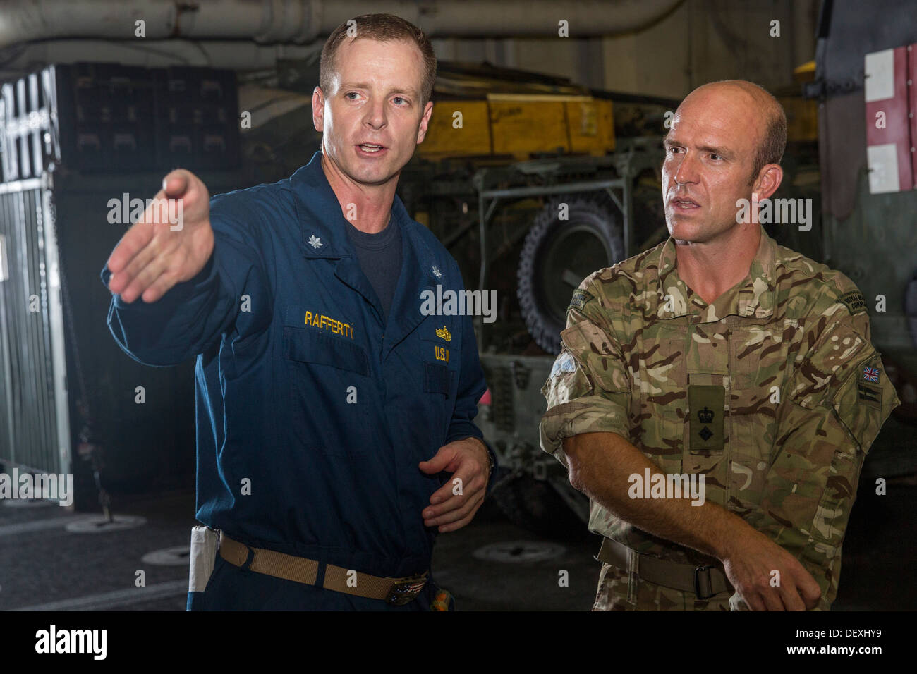 Cmdr. Kevin Rafferty gives a tour to members of the British Royal ...