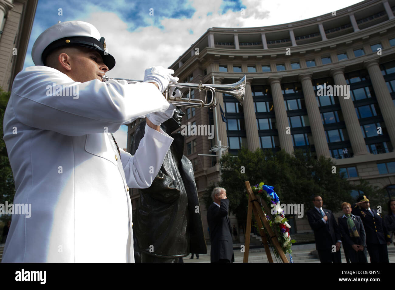 A bugler plays taps after Secretary of Defense Chuck Hagel and Chairman of the Joint Chiefs of Staff Gen. Martin Dempsey lay a wreath at the Navy Memorial in Washington. The defense leaders held the ceremony to honor the 12 victims of a shooting Sept. 16, Stock Photo