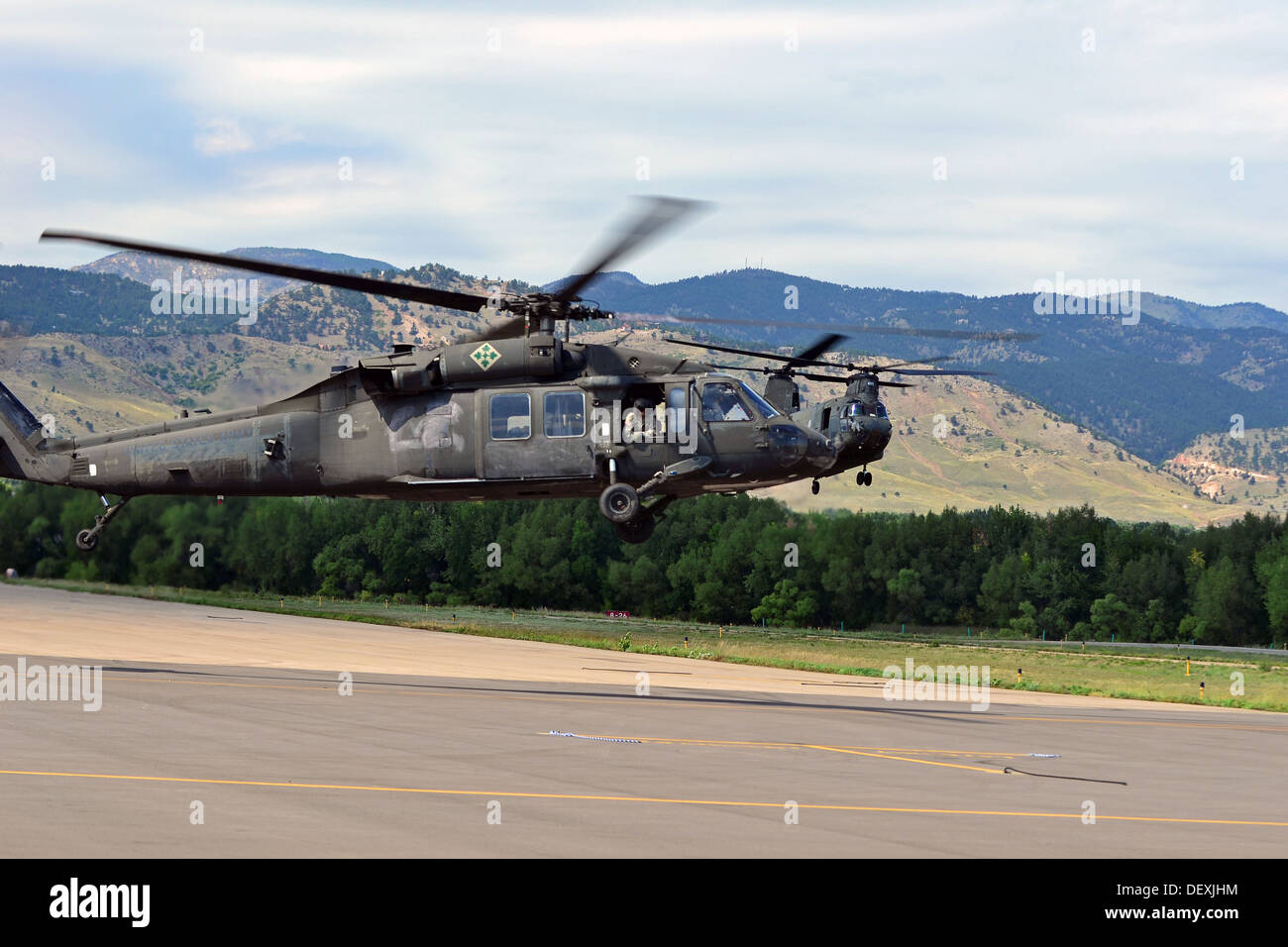A UH-60 Black Hawk helicopter with the 2nd General Support Aviation Battalion, 4th Aviation Regiment, 4th Combat Aviation Brigade, 4th Infantry Division, prepares to land in Boulder, Colo., Sept. 19, 2013. Colorado and Wyoming National Guard units were ac Stock Photo