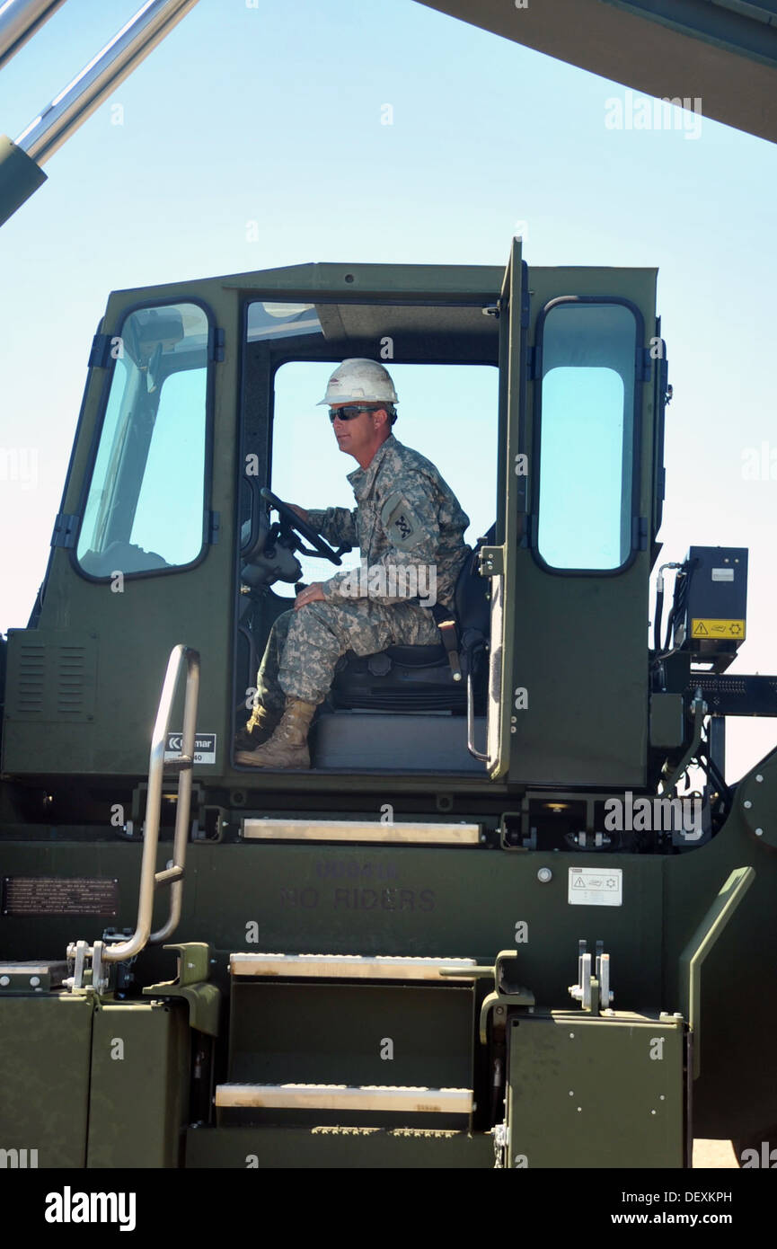 U.S. Army Reserve Sgt. Landon Kinney, a cargo specialist, 650th Transportation Company (Seaport Operations), operates the Kalmar Stock Photo