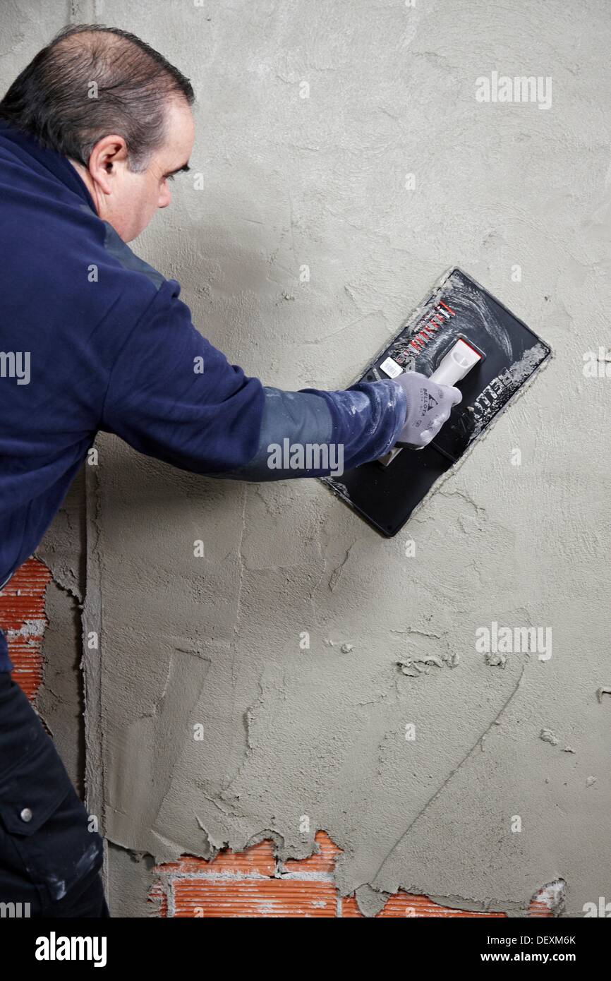 Roughcast, plastering trowel, new homes under construction