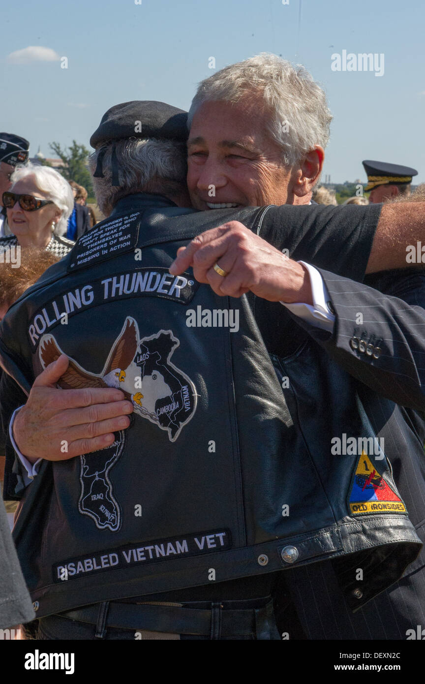 Defense Secretary Chuck Hagel hugs a man after the POW/MIA National Recognition Day Ceremony at the pentagon in Washington D.C. Stock Photo