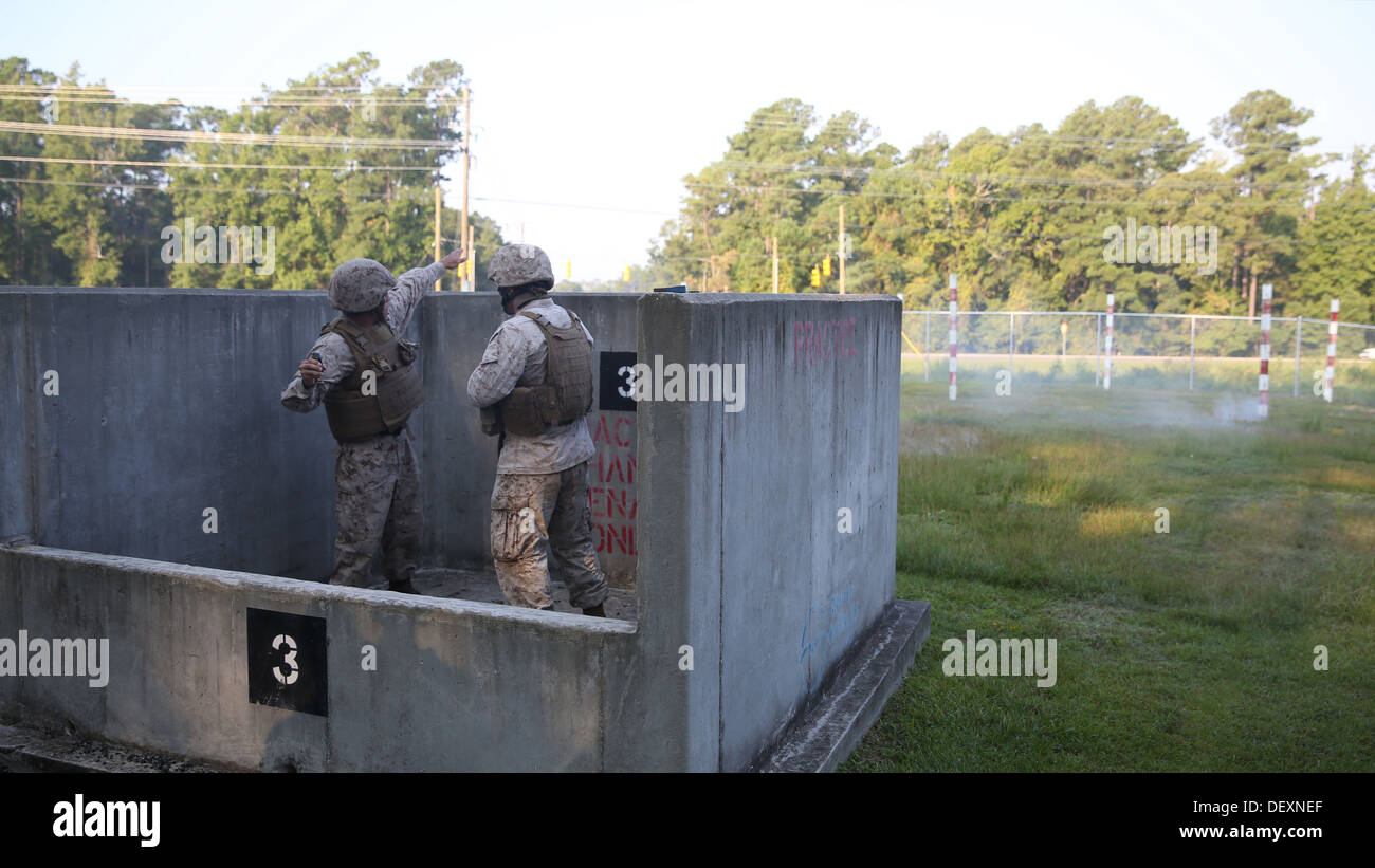 A Marine with Bridge Company, 8th Engineer Support Battalion, 2nd Marine Logistics Group prepares to throw an M-69 training grenade on a grenade range aboard Camp Lejeune, N.C., Sept. 10, 2013. Service members with the unit used the M-69s to prepare them Stock Photo