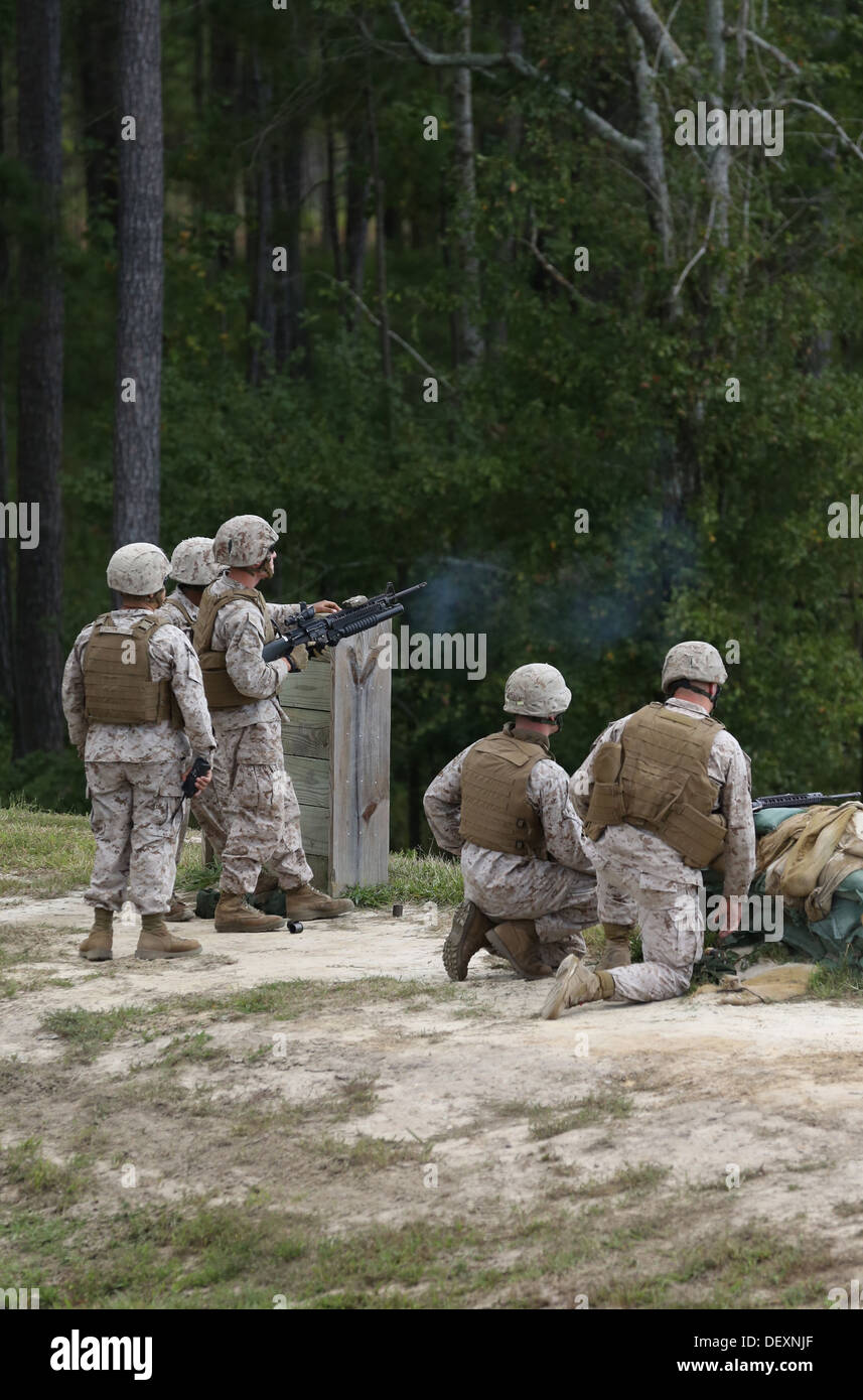 A Marine with Bridge Company, 8th Engineer Support Battalion, 2nd Marine Logistics Group fires an M-203 grenade launcher downrange as part of a grenade training exercise aboard Camp Lejeune, N.C., Sept. 17, 2013. The operation provided the service members Stock Photo