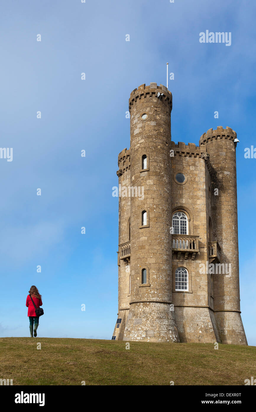 A woman walks towards Broadway Tower, Broadway Tower and Country Park