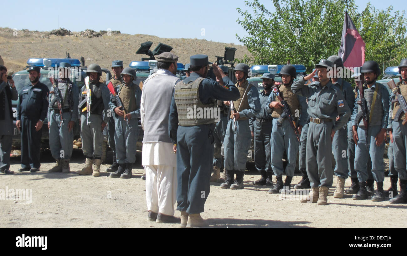 Mohammad Jan Rassoulyar, the Zabul deputy provincial governor, and Col. Jilani Khan, Zabul deputy provincial chief of police, address a formation of Afghan Uniformed Police before conducting a men's shura in Atghar District Sept. 19, 2013. Stock Photo