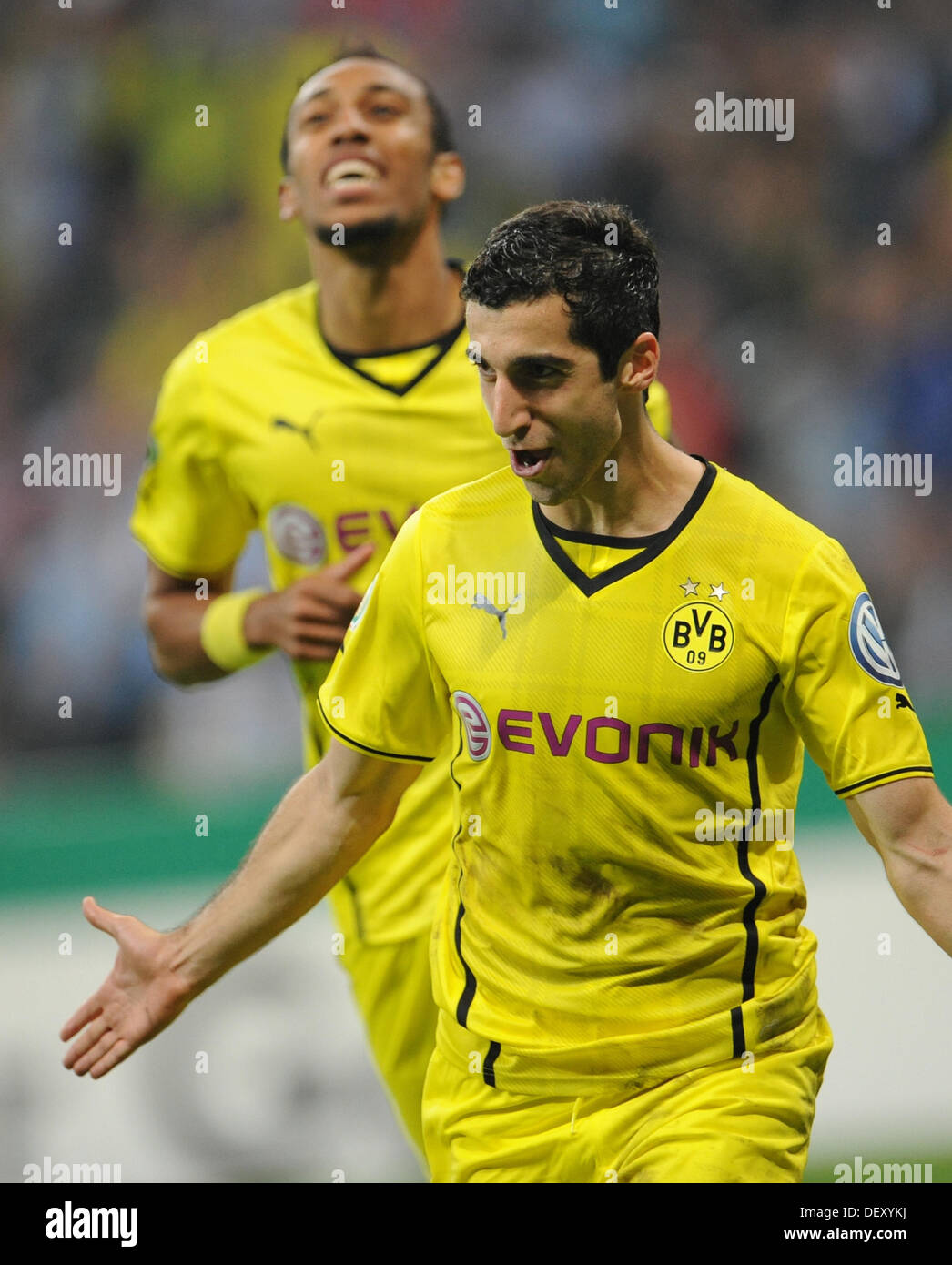 Munich, Germany. 24th Sep, 2013. Dortmund's Pierre-Emerick Aubameyang (L) and Henrich Mchitarjan celebrate the 2-0 goal during the DFB Cup second round match between TSV 1860 Munich and Borussia Dortmund at Allianz Arena in Munich, Germany, 24 September 2013. Photo: ANDREAS GEBERT/dpa/Alamy Live News Stock Photo