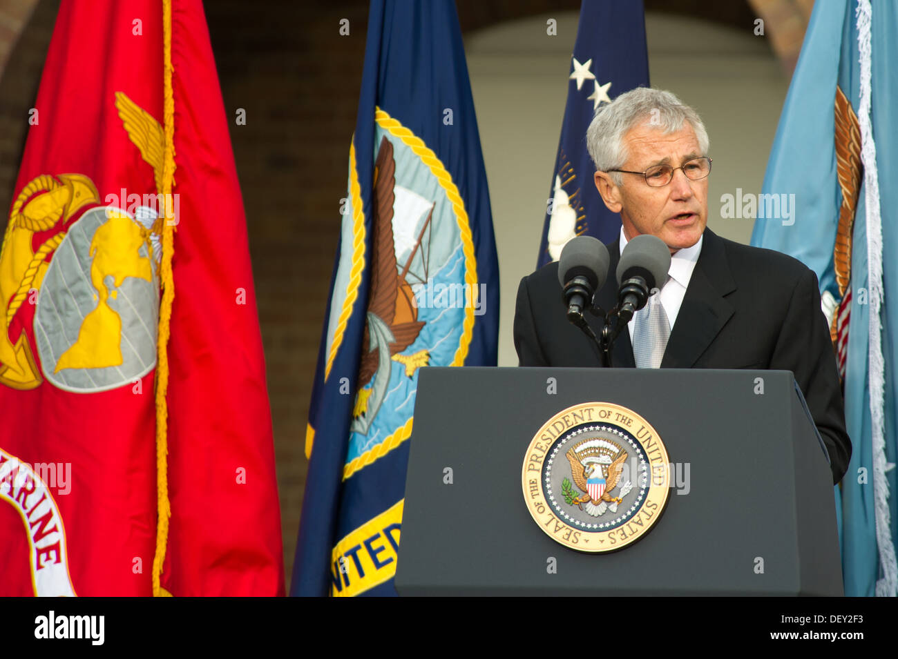 Defense Secretary Chuck Hagel speaks during a memorial for those killed during a shooting at the Navy Yard, at the Marine Barracks in Washington D.C., Sept. 22, 2013. 12 people were killed Sept. 18, 2013. Stock Photo