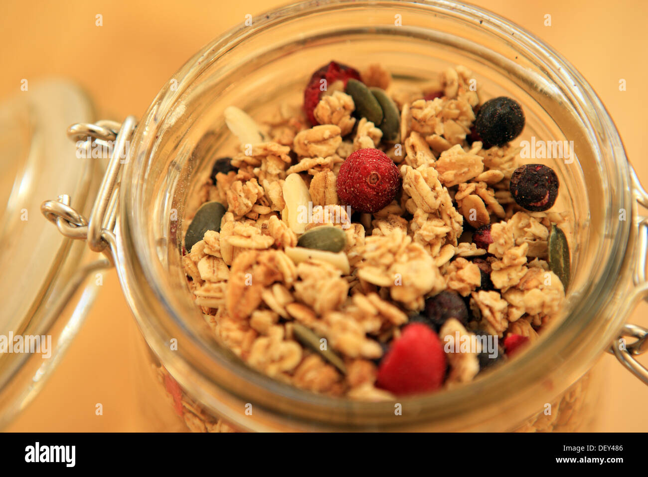 Glass jar of berry granola Stock Photo