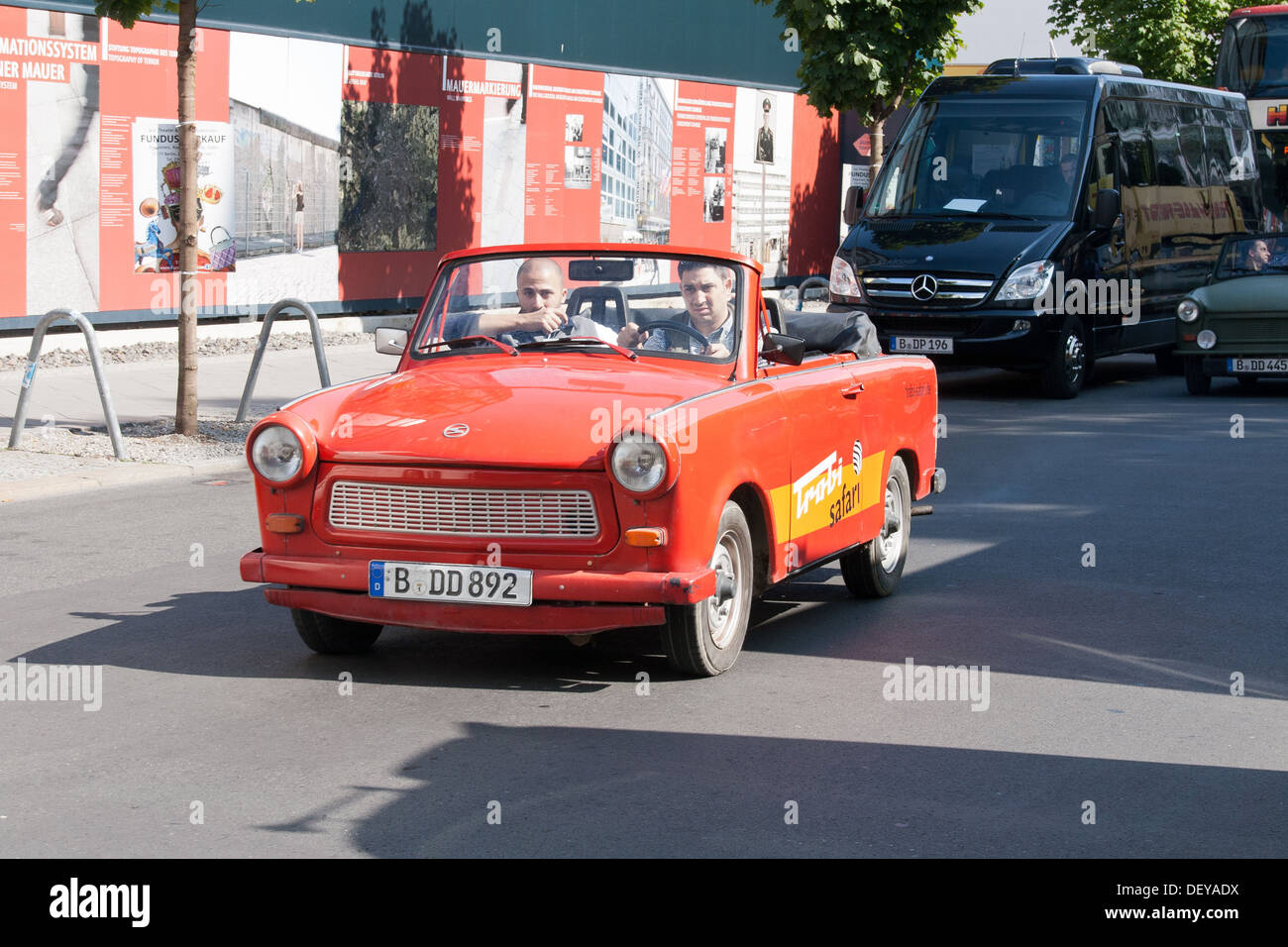 A trabant at Checkpoint Charlie Friedrichstrasse - Berlin, Germany Stock Photo