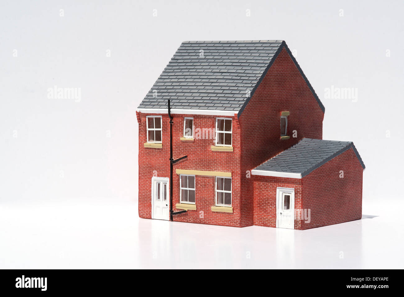 Model of detached house on white background Stock Photo - Alamy