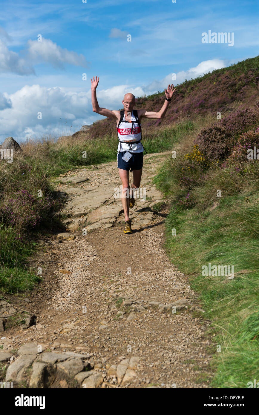 Cross country fell runners in the Peak District Derbyshire a 20 mile off road endurance race for charity Stock Photo