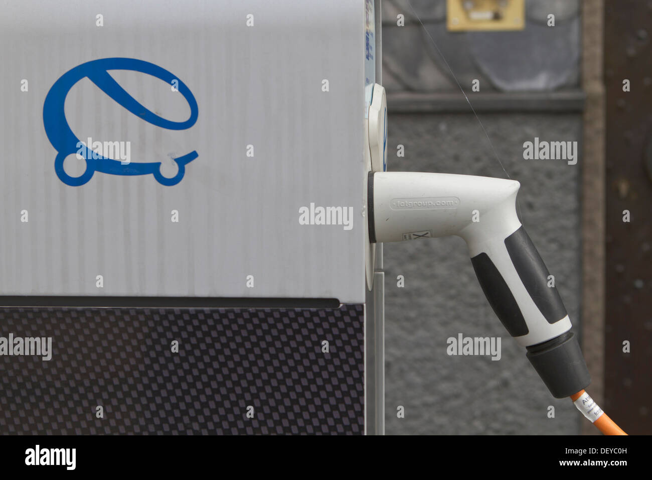 Plug, cable plugged into a charging station for electric cars, North