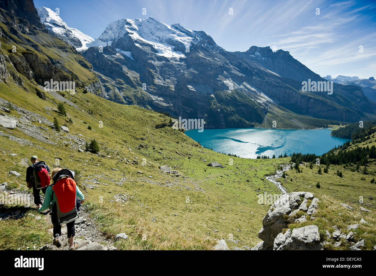 Hikers at Oeschinensee, Oeschinen Lake, Bernese Oberland, Canton of Bern, Switzerland, Europe Stock Photo