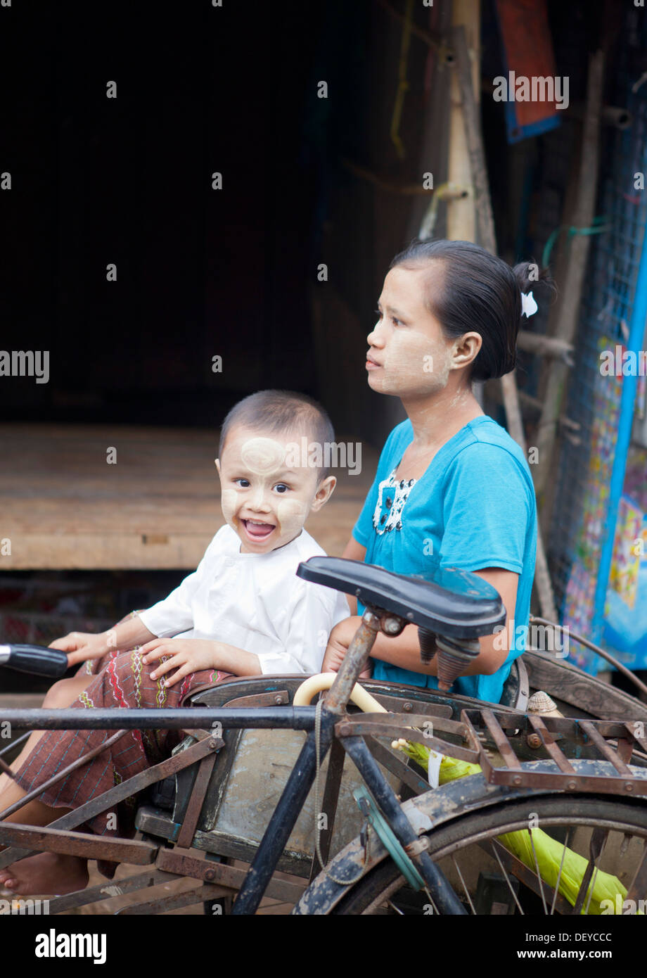 A child with his mother in Hpa-An, Burma. Stock Photo