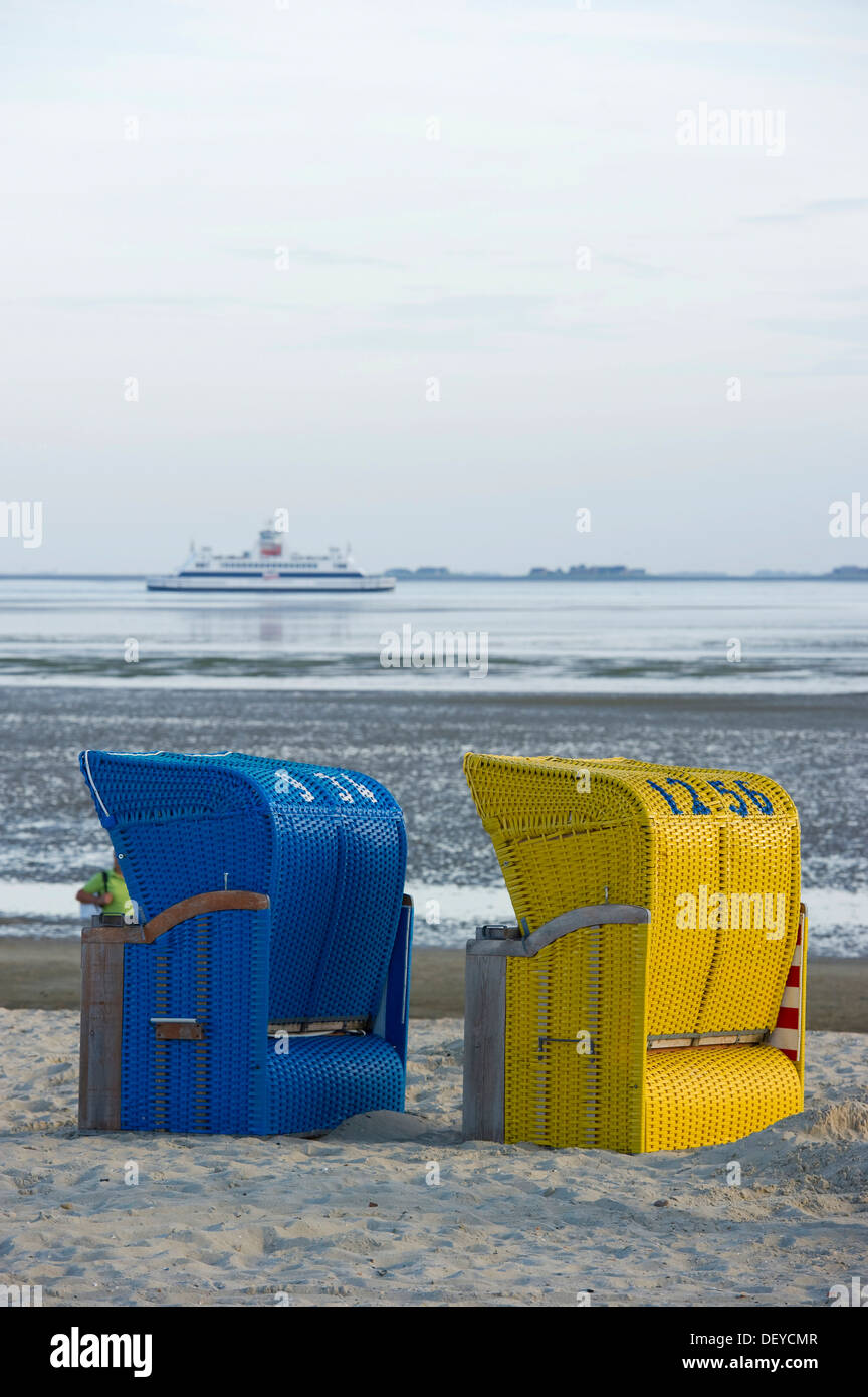 Colourful roofed wicker beach chairs on the beach near Wyk, Foehr