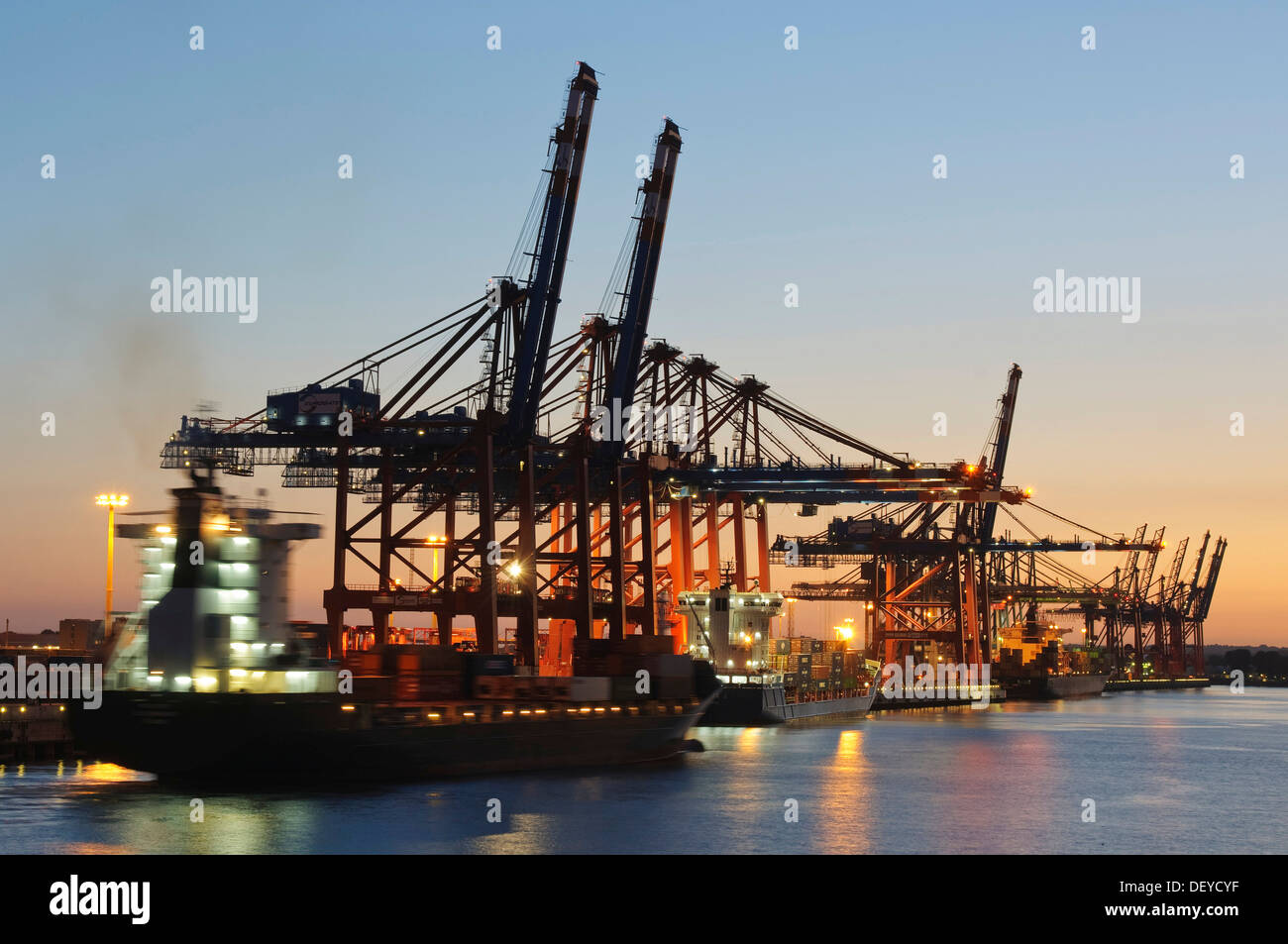 Eurokai container terminal in the port of Hamburg at sunset, Hamburg Stock Photo