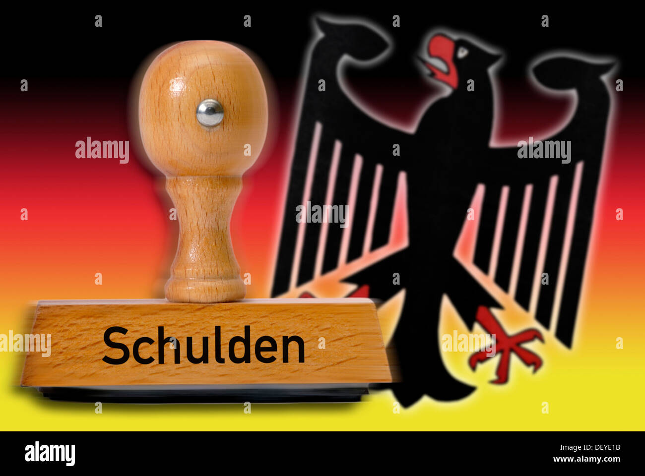 Stamp with the word 'Schulden', debt, German eagle and national colors Stock Photo