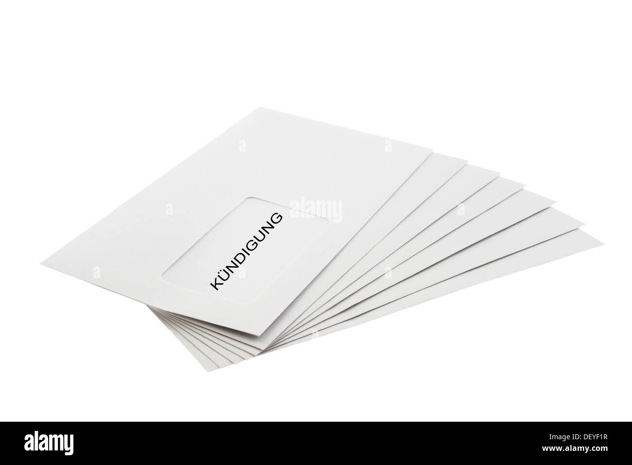 Kundigung (German dismissal) written on a Batch of Envelopes isolated on White Background Stock Photo