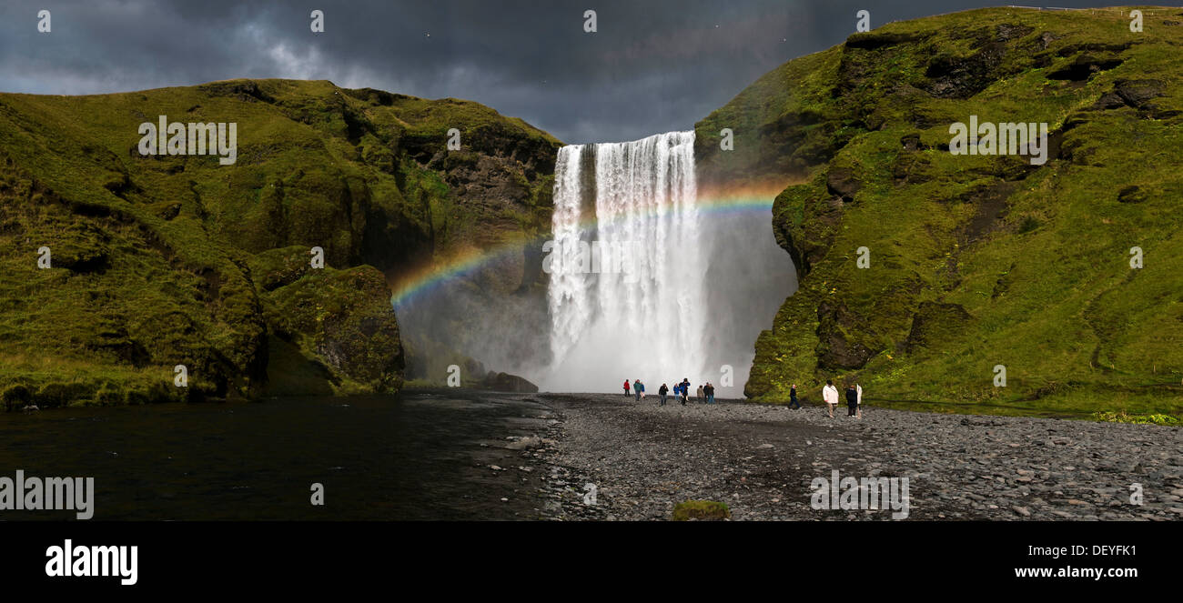 Waterfall and rainbow, Skogafoss, Skógar, Rangarþing eystra, Southern Region, Iceland Stock Photo