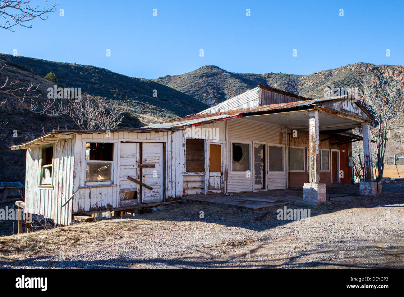 A derelict building sits on a hillside between Cottonwood and Jerome in