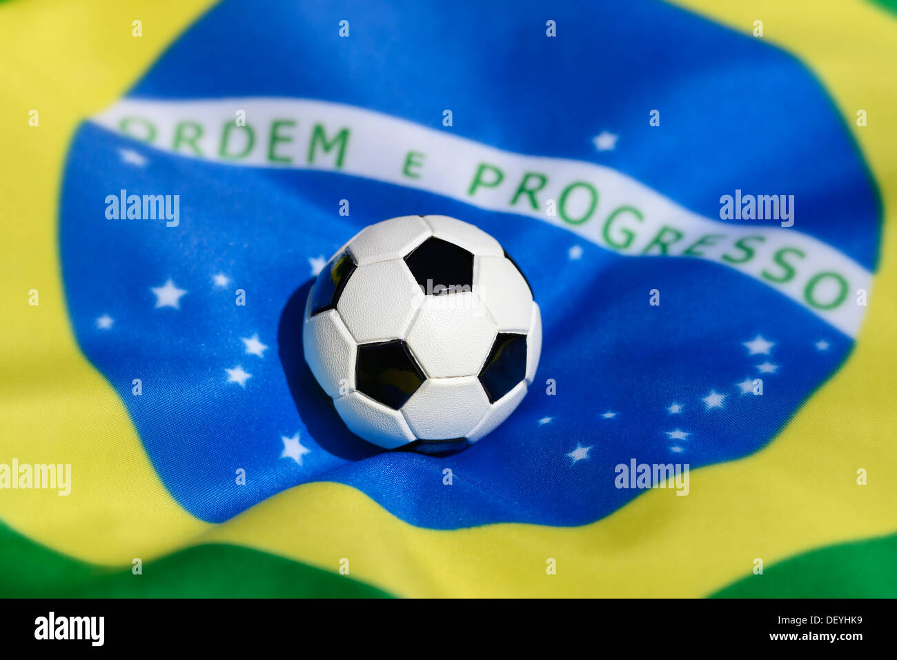 Football on Brazilian flag, football world championship in 2014 in Brazil, Stock Photo