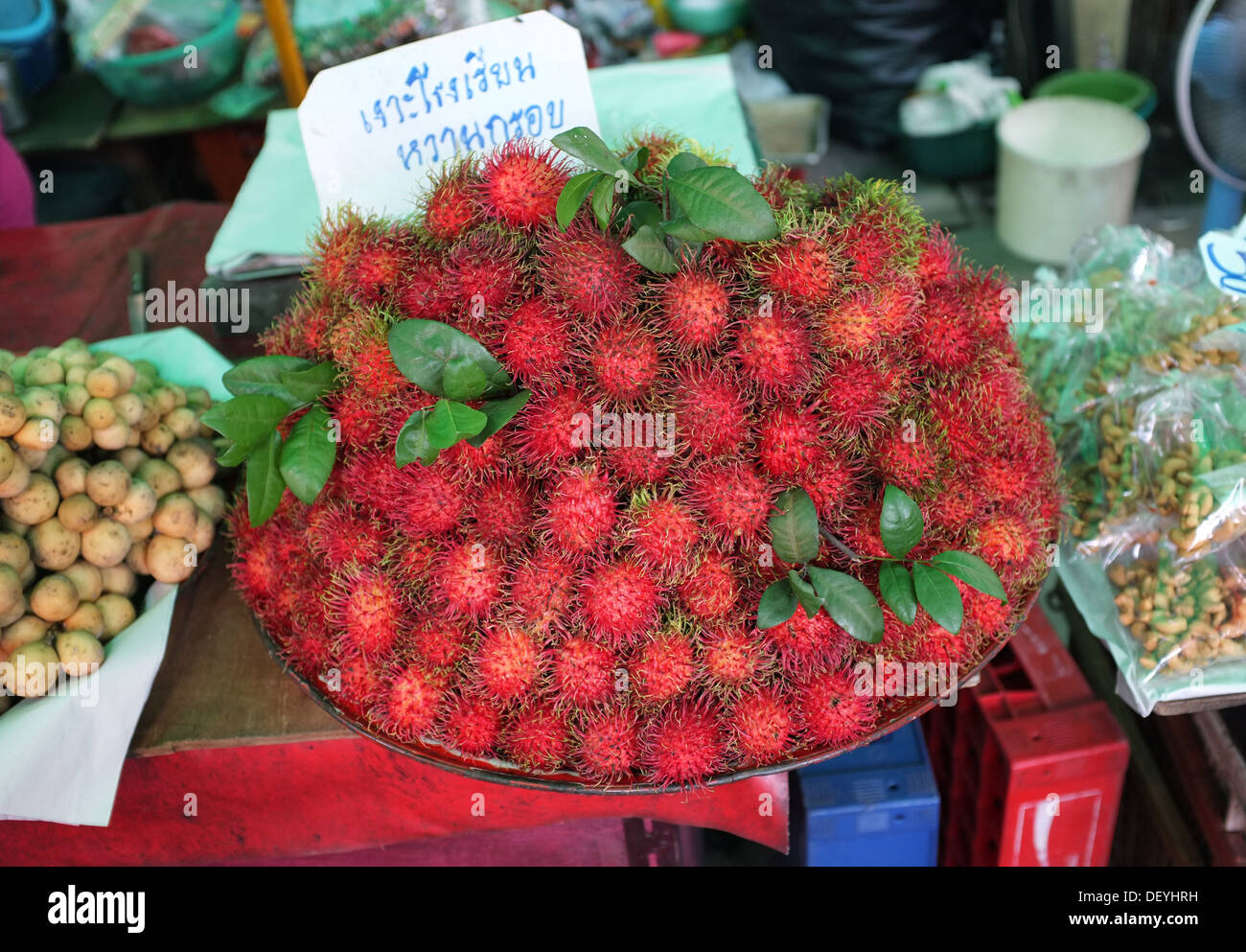 Rambutan fruit for sale at market in Bangkok, Thailand Stock Photo