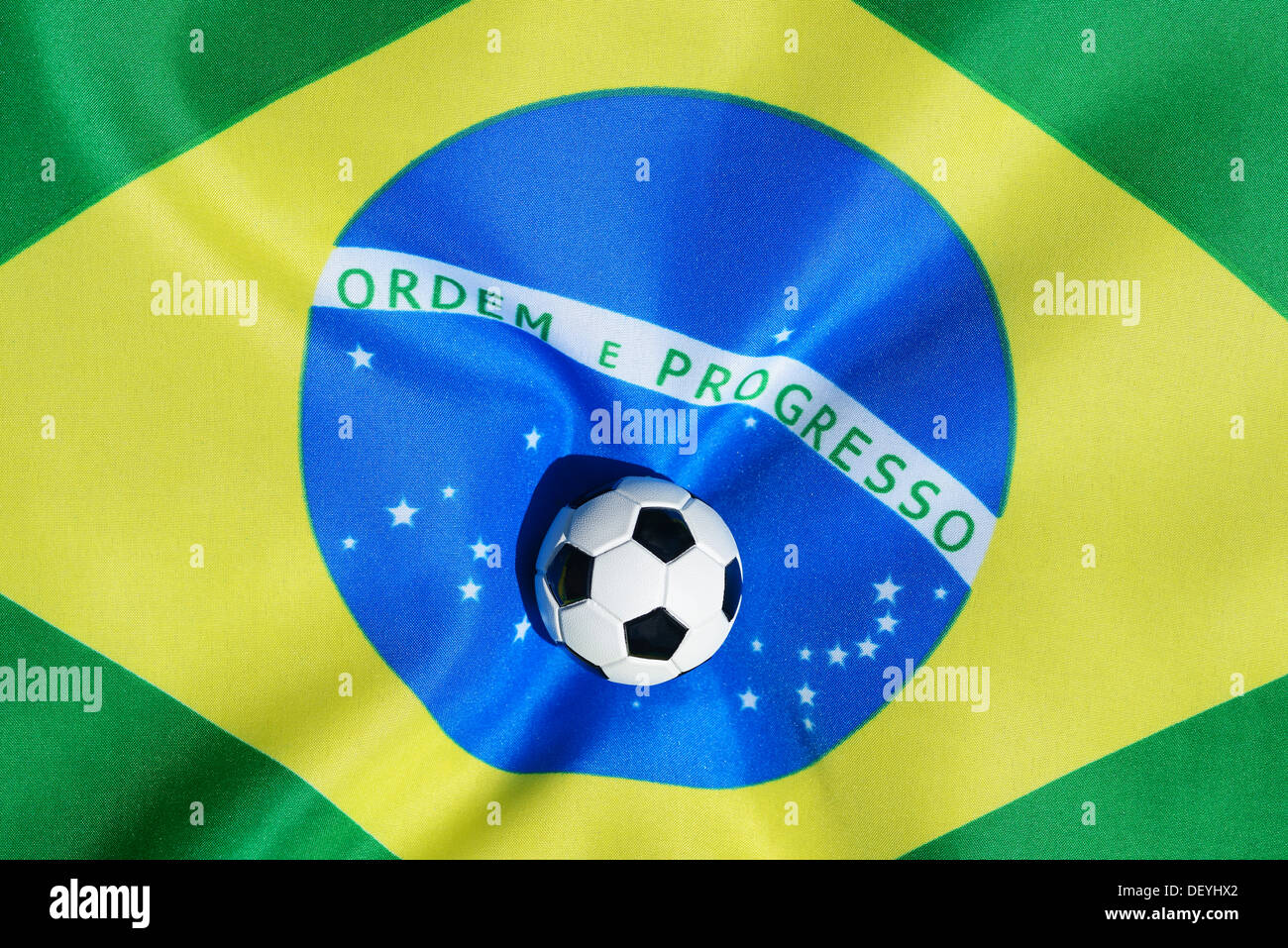 Football on Brazilian flag, football world championship in 2014 in Brazil, Stock Photo