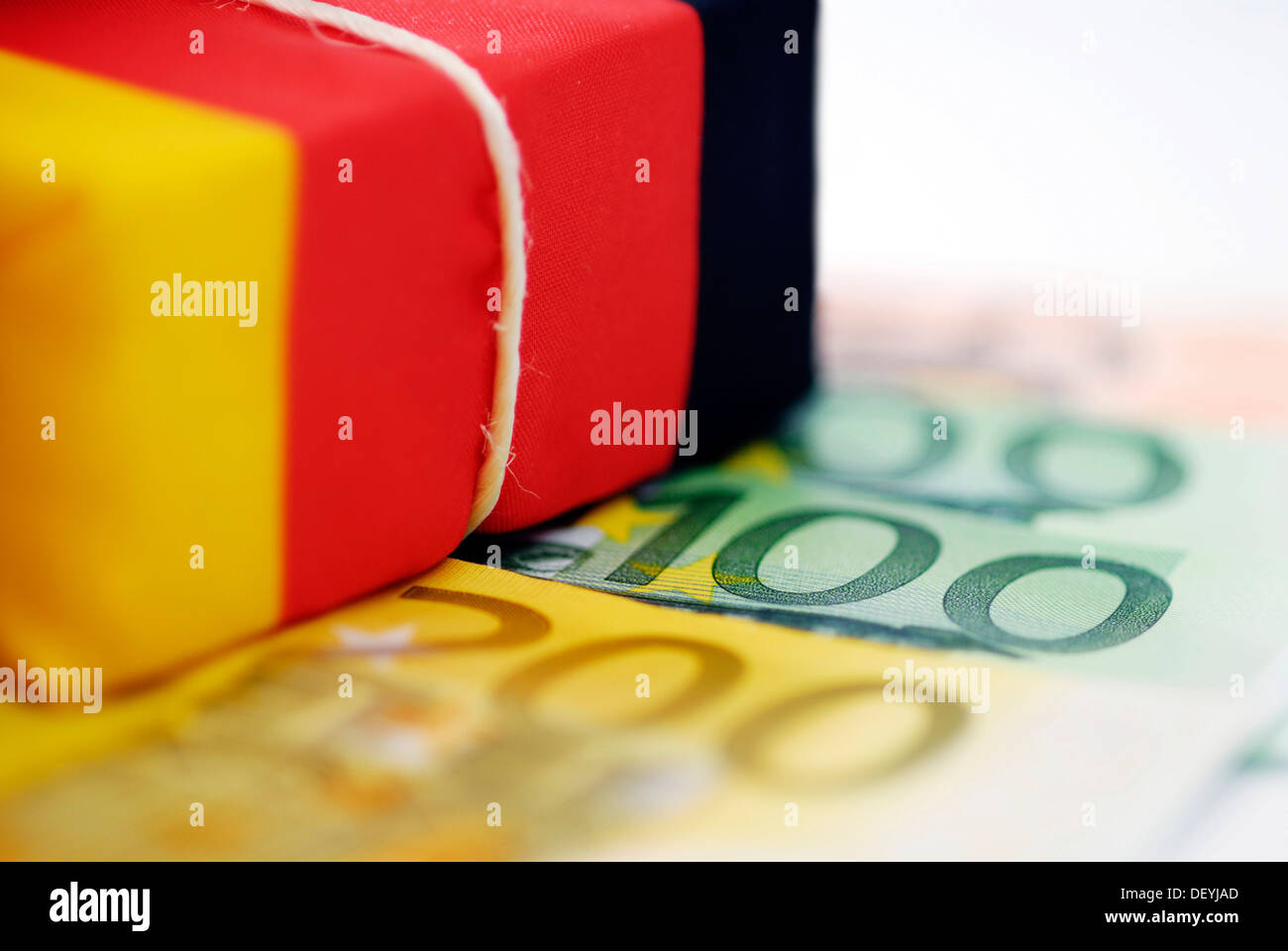 Parcel in German national colours on banknotes, symbolic picture German ...