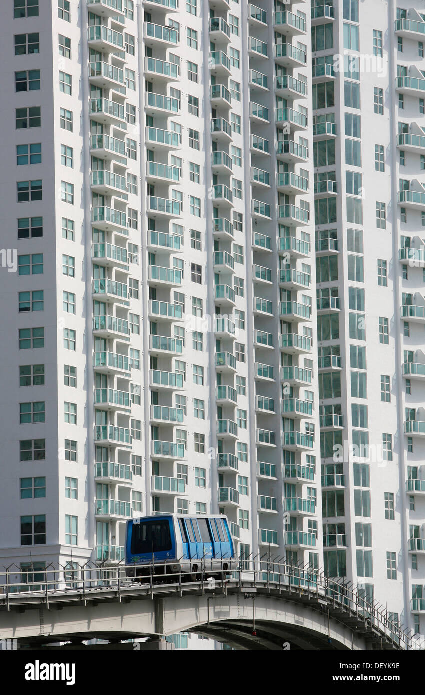 Metrorail coach in front of apartment building in the financial district of Miami, Florida, USA, America Stock Photo
