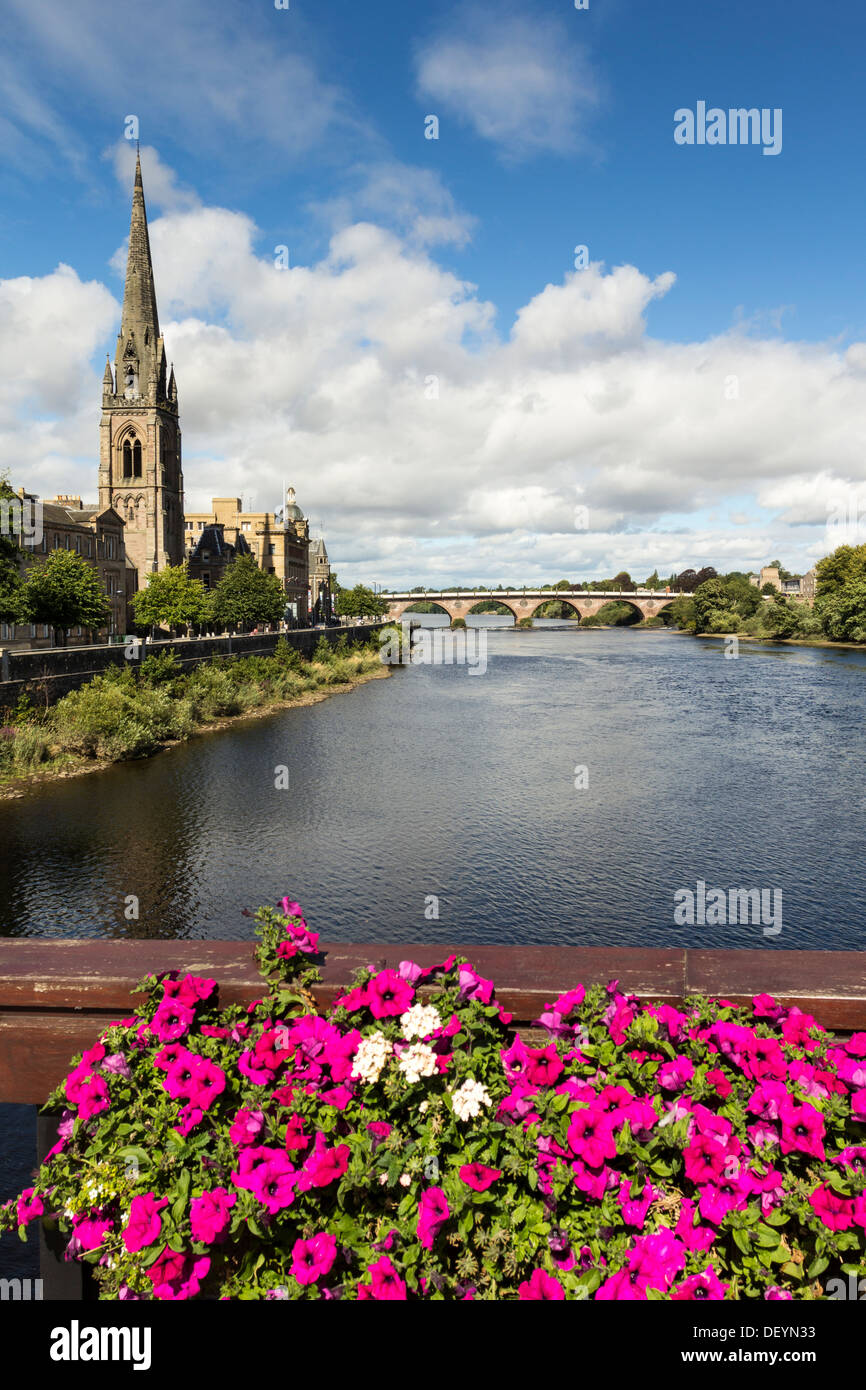 PERTH CITY SCOTLAND WITH FLOWERS AND ROAD BRIDGE OVER THE RIVER TAY