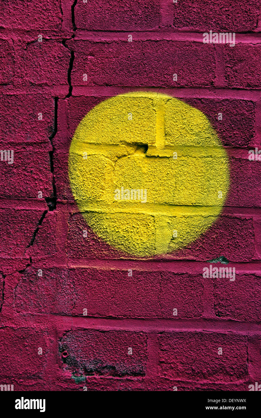 Yellow dot on a graffiti wall Stock Photo Alamy