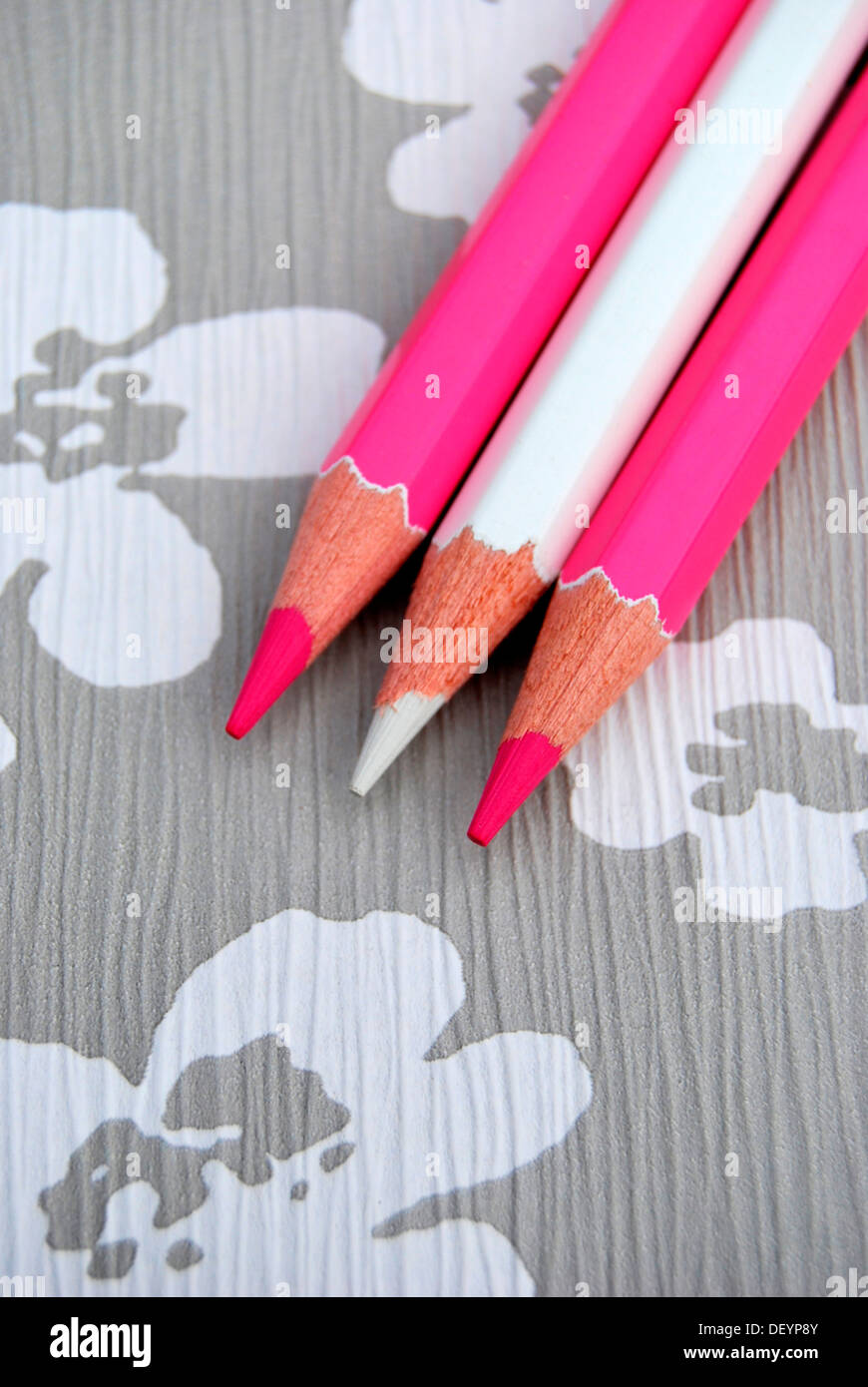 Several pencils on flowery background, creativity Stock Photo