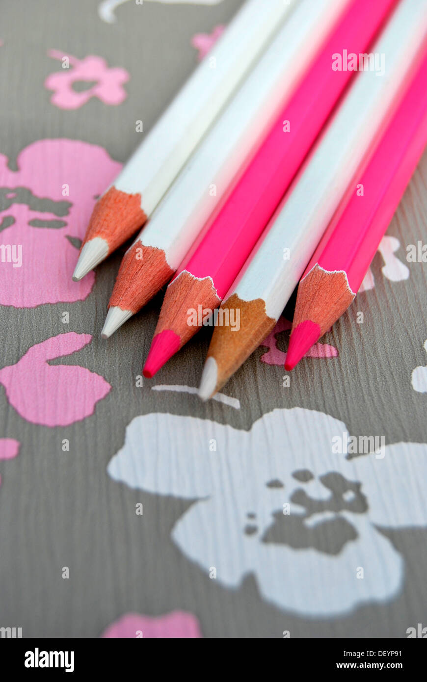 Several pencils on flowery background, creativity Stock Photo