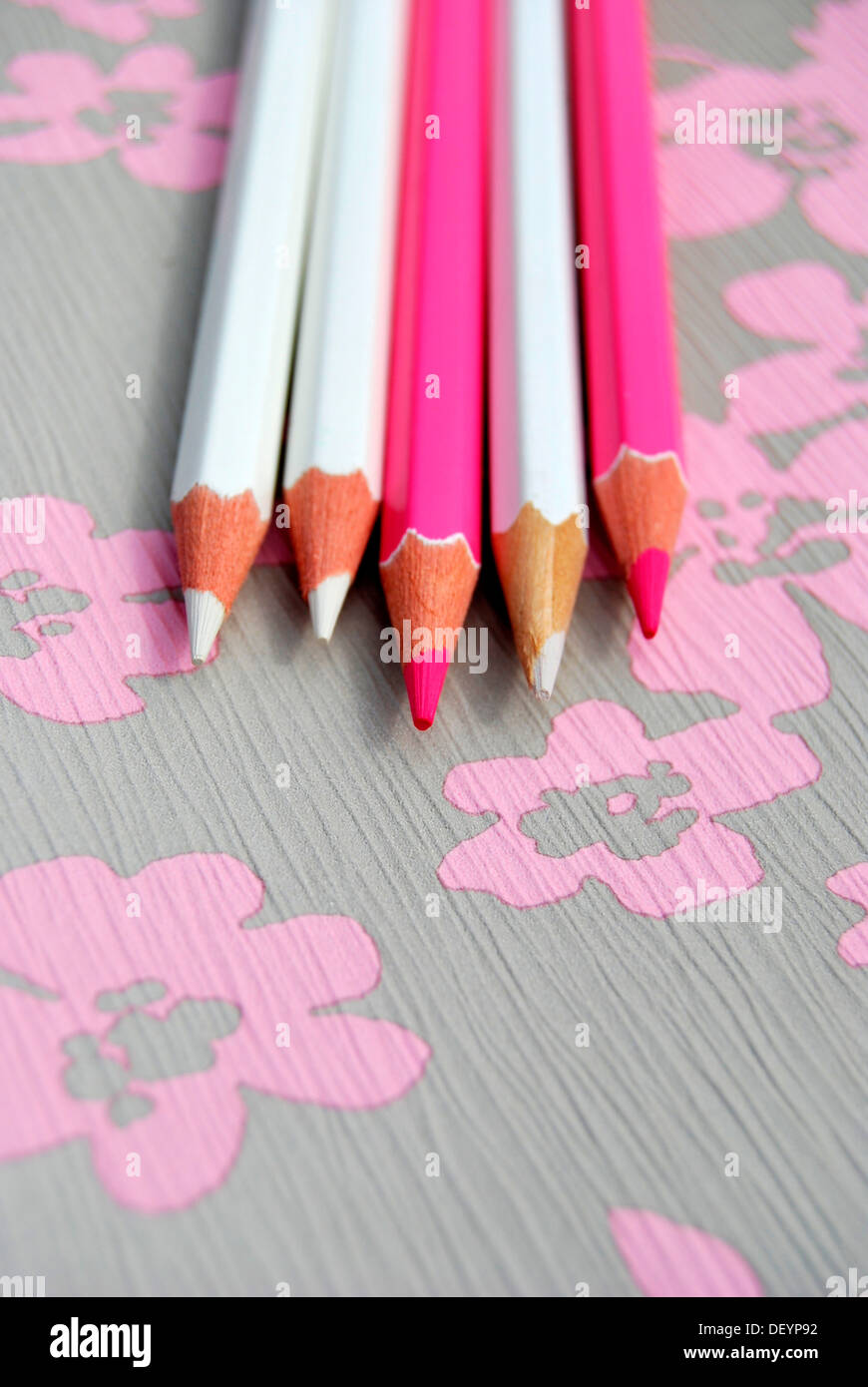 Several pencils on flowery background, creativity Stock Photo