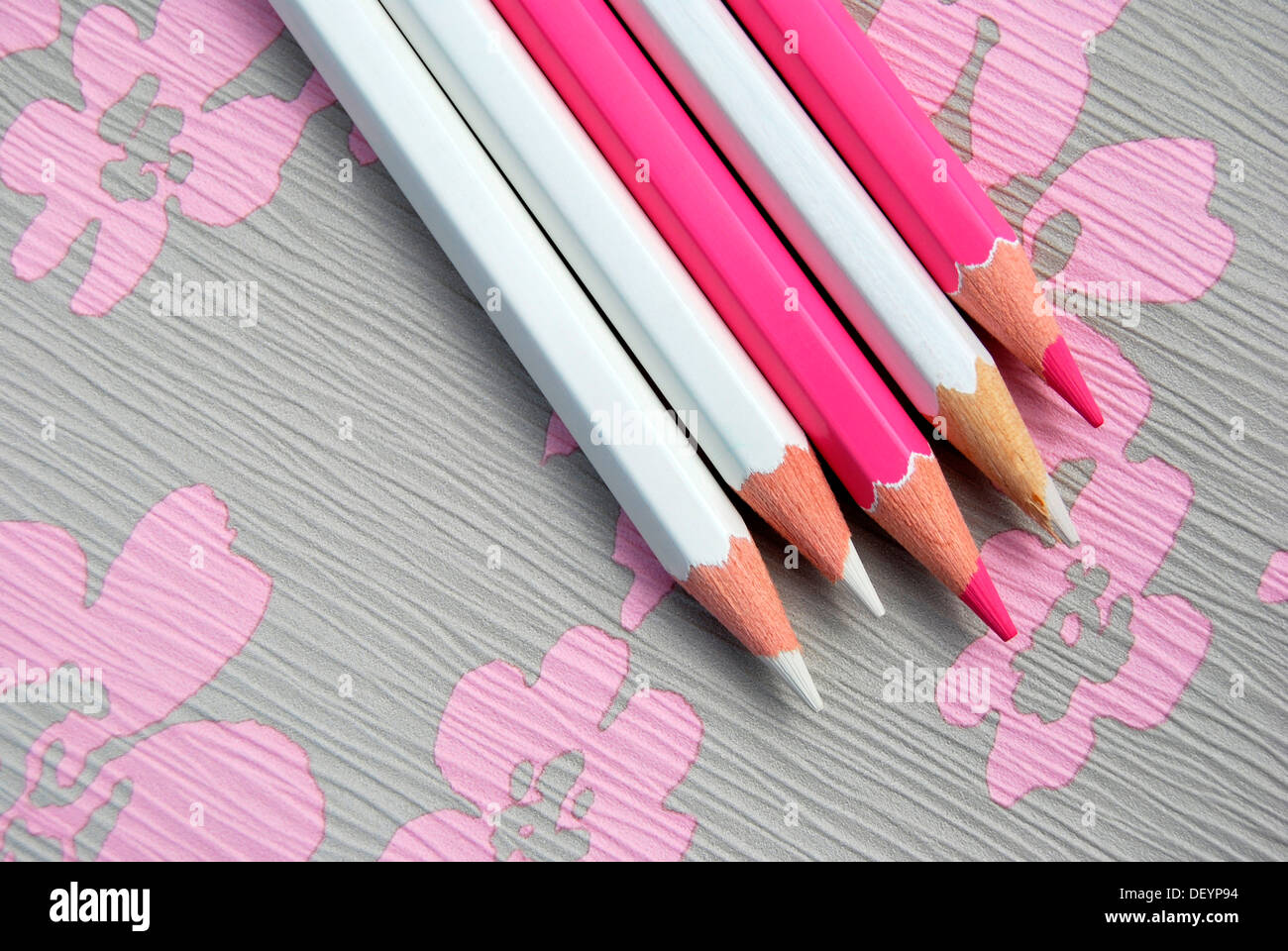 Several pencils on flowery background, creativity Stock Photo