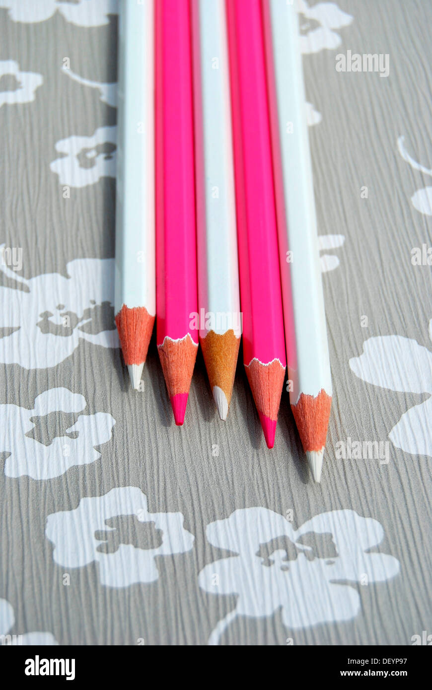 Several pencils on flowery background, creativity Stock Photo