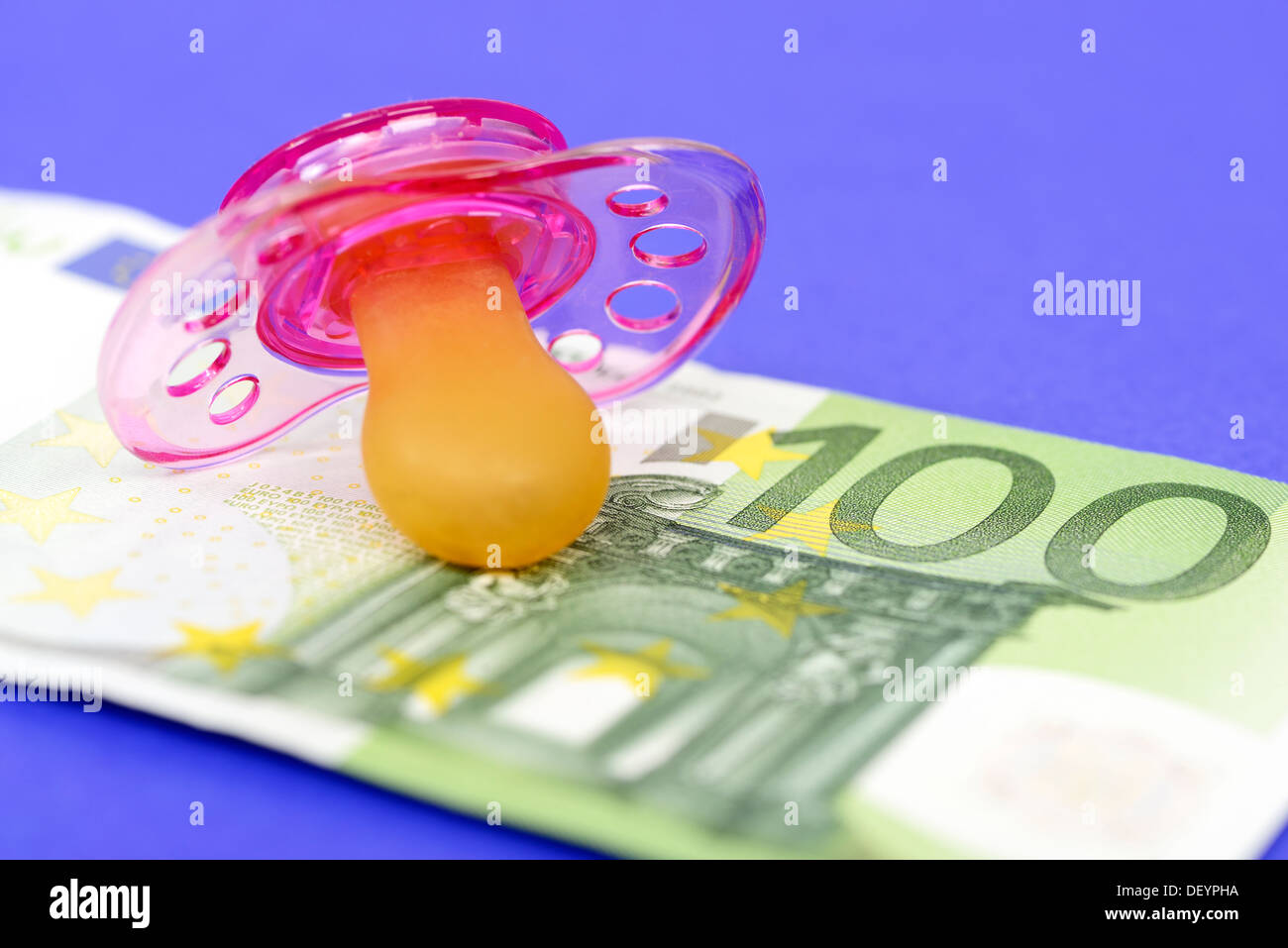 Dummy on euro hundred, symbolic photo care money, Schnuller auf Hundert-Euro-Schein, Symbolfoto Betreuungsgeld Stock Photo
